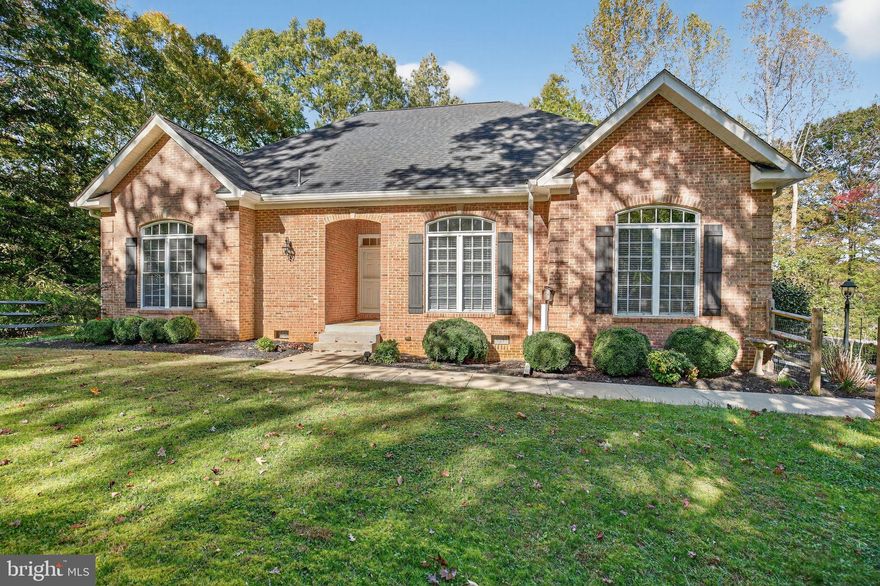 MAIN LEVEL LIVING AT ITS FINEST! Located in eastern Charles County, this property is an easy commute to Washington, DC, Northern VA, and all points in Southern Maryland. The custom home features 5 bedrooms and 3.5 baths, offering over 3,400 finished square feet on 3.7 acres. Best of all, there’s no HOA! You’ll find everything you desire on the main level, complemented by an expansive lower level that includes an in-law suite with a second kitchen, living and dining areas, a bedroom, and a full bath.
From the moment you arrive, you’ll appreciate the paved driveway with extra parking spaces and a large turnaround radius. Step through the front door into a soaring living room featuring 12-foot cathedral ceilings, ample natural light from the skylight, and a gas fireplace adorned with built-in bookcases and shiplap reaching all the way to the ceiling. The kitchen is equipped with a four-door refrigerator, skylight, and lofty ceilings. It seamlessly connects to both a breakfast room on one side and a formal dining space on the other. The breakfast area also includes a desk/coffee bar and a built-in counter-height hutch with glass doors. From here, solve all the world’s problems with coffee or cocktails by stepping right out onto the oversized screened porch with a ceiling fan. 
There are four bedrooms on this level—two on each side for added privacy—each with 10-foot ceilings, ceiling fans, crown molding, and stunning hardwood floors. The spacious primary bedroom features a large walk-in closet outfitted with a name-brand closet system. Unwind in the ensuite bath, which includes a large soaking tub, a chandelier, a step-in shower, a skylight, and ample cabinet storage. Adjacent to the primary suite is another bedroom with a 15-pane glass door, ideal for a private office.
A powder room in the hall caters to guests on this side of the home. On the east side, you’ll find two additional bedrooms and a full bath in the hall. Just off the kitchen, a mudroom/laundry room featuring front-loading washer and dryer, butcher block countertops, and a large walk-in pantry, also leads to the garage and basement, . The oversized two-car garage includes a second refrigerator designed to withstand temperature fluctuations, as well as a utility sink and workbench.
Descending to the lower level, you’ll discover under-stair storage and a spacious storage/utility room. The hallway leads to the in-law suite, which boasts a large living area that flows into a sizeable kitchen with a dining area. This kitchen is equipped with a third refrigerator, oven, built-in microwave, dishwasher, pantry, and generous cabinet space. The fifth bedroom is located here, along with a full bath featuring a shower stall and hookups for a stackable washer/dryer, offering flexibility for multigenerational living. A separate entrance with a covered patio area and walkway to the driveway adds potential for rental space.
Recent updates enhance this home’s value: in 2022, the seller paved the existing gravel driveway and the entire shared access road, cleared trees that posed potential fall risks, replaced the roof, and added a new gutter system. The HVAC system was updated in 2021-2022. The extensive hardscape includes an effective drainage system with retaining walls and French drains.
Outside, there is a fenced area for furry friends, and the landscape is breathtaking, featuring over 20 varieties of shrubs, flowers, and trees. Enjoy solar lighting, a birdhouse, bird bath, fire pit, and even a tire swing as you soak in the beauty of nature. This home was constructed with quality materials, leaving nothing for you to do but move in and start enjoying life!