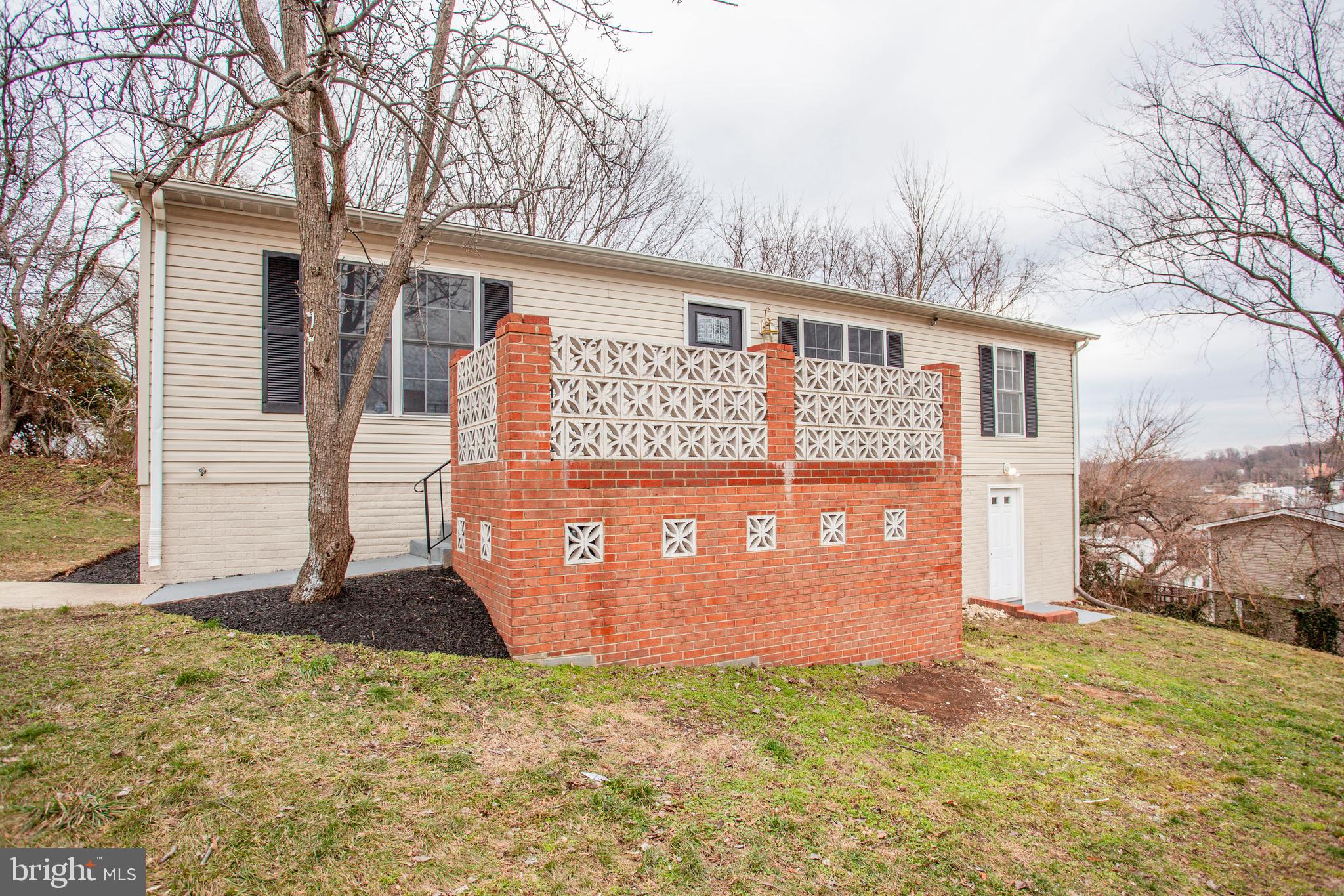 Step into your amazingly renovated home in Capitol Heights that features both modern amenities and is in a fantastic location. Entering your home, you will walk upon freshly done luxury laminate floors that is found throughout your house. You will feel like a top chef cooking in your new upgraded modern kitchen outfitted with beautiful granite countertops, modern white shaker cabinets, and newly installed Samsung stainless steel appliances. There is plenty of room when having family and friends over, as your home features 4 bedrooms that can serve as guest rooms and as a private working space as well. There are 3 full baths and one of them is found in your master bedroom. And it doesn't end here, walking downstairs you have a newly finished walk-out basement that can serve as an in-law suite with a fully upgraded modern kitchen as the one found upstairs! Do you have your investor hat on because if you do this is the perfect home for house hacking with potential to rent out the basement! Only 7min walk from Capitol Heights Metro. Price To Sell Fast.