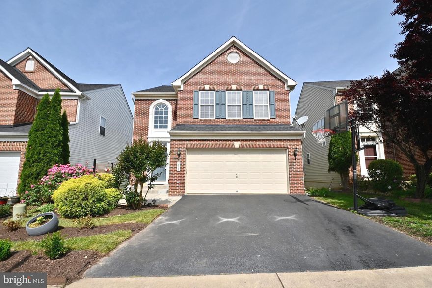 Welcome to this remarkable East-facing, open-floor Sheridan Model sitting on a premium lot. This four-bedroom, three-and-a-half bath home has been well maintained by a single owner and features several upgrades - a private fenced-in stone patio, roof replaced 2 years ago, HVAC replaced 1 year ago, second kitchen, electric car charging outlet, NEW hardwood floors on the second level and freshly painted walls.
As you enter, you'll be greeted by a two-story foyer that leads you to the formal dining room and living room inundated with natural light. The main level boasts beautiful hardwood floors throughout with a gas fireplace. The gourmet kitchen is complete with granite countertops, a tile backsplash, and stainless steel appliances. The kitchen opens up to the family room and a newly added staircase leads to the patio from the main level. Upstairs, newly added hardwood floors flow throughout the entire level, creating a warm and inviting atmosphere. The primary suite boasts a grand tray ceiling, a generous walk-in closet, and a luxurious master bathroom featuring a jacuzzi and glass shower. The upper level also includes 3 other bedrooms and a conveniently located laundry room with a utility sink. 
The fully finished basement offers a living space with an entertainment area, full bath, kitchen, and a walk-out basement. French doors in the basement add plenty of natural light and lead to a private fenced patio that is surrounded by trees and perfect for hanging out with family and friends. Extra parking spaces are right in front of the home. 
Don't miss out on the opportunity to own this stunning home in a highly sought-after neighborhood with top-rated schools (Lee's Corner Elementary, Oak Hill Elementary, Franklin Middle, Rachel Carson Middle, and Chantilly High). Explore the walking trails that connect many communities and are popular with pets. Walk to restaurants and shopping on Metrotech Drive. Close proximity to several retailers and malls.  Only 8 minutes to Herndon metro station and Dulles International Airport.