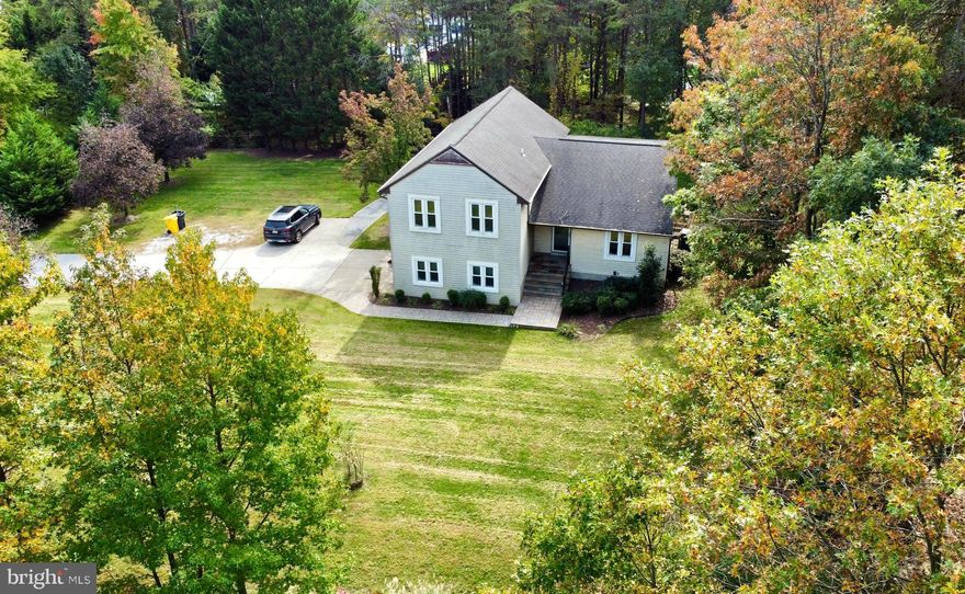 Welcome home! This 3 Bedroom, 2.5 Bath split level style single family home is perfect for those looking for a quiet neighborhood minutes from Baltimore, Annapolis, DC and more. The main level has gorgeous Brazilian cherry hardwood floors through out, an open layout featuring modern updated kitchen with quartz counter tops and a island, Metro Gray Polished Ceramic tile back splash, modern cabinets, with stainless steel appliances (electric range, microwave, dishwasher) and recessed lighting. At the lower level you’ll find a cozy family room with a nice size wet bar and around the corner a conveniently located half bath and access to the 2 car garage. At the next lower level a fully finished basement with out side access and a laundry room with a full size washer & dryer a sink and lots of room for storage.   Upstairs features 3 fully carpeted nice size bedrooms and 2 full baths. The Master bedroom has a large walking closet with a large Master bath. The other 2 light filled  rooms share a newly renovated full bath. From the kitchen through a new slighting glass door connects you to a very spacious partially covered deck with fans and stairs that lead to a large private backyard surrounded by mature tree and a pond where you'll enjoy entertaining your guest or just relaxing. Don't miss this great opportunity to get into a very unique home with no HOA. 
MORE PICTURES COMING SOON