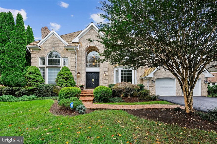 OPEN SATURDAY, 10/25, 1-3pm

CUL-DE-SAC GEM IN AVENEL
Step into a showstopper that feels straight from the pages of a luxury design magazine! Nestled on a quiet cul-de-sac in Potomac’s prestigious Avenel community, this stunning residence blends tasteful finishes, smart architectural details, and effortless style to create a home that’s as functional as it is breathtaking. Designed with both comfort and sophistication in mind, this stately all-brick Colonial boasts over 6,000 square feet of elegantly appointed living space, including 7 bedrooms, 4.5 baths, and thoughtfully curated updates throughout. Set on a secluded lot with no rear neighbors, it offers rare privacy and a serene atmosphere. With an all above-ground lower level with abundant natural day light, and a peaceful, private setting, this impeccable property is a true standout!

The beautifully landscaped front yard, anchored by a striking Japanese maple and mature plantings, creates a warm and welcoming approach. Recent improvements include brand-new LVP flooring in the walk-out basement, and fresh paint throughout, including the garage, and HVAC replaced in 2017.

A grand two-story marble foyer with a sweeping circular staircase, a contemporary designer chandelier  and stylish balcony hallway makes a stunning first impression. This spectacular space is flanked by formal living and dining rooms. The living room is a brilliant architectural showcase, with a soaring ceiling, a marble-surround fireplace, and a striking two-story Palladian window that fills the space with natural light. The formal dining room features wainscoting, crown molding, and a bay window, creating a timeless atmosphere for entertaining.

A private office with hardwood floors and a large bay window overlooks the backyard and flows into the sun-drenched family room, where a stone fireplace and a dramatic wall of glass doors open to an expansive Trex deck—perfect for effortless indoor-outdoor living.

The open-concept kitchen is a chef’s dream, showcasing quartz countertops, a large center island with gas cooktop, Sub-Zero paneled refrigerator, double ovens, farmhouse sink, custom cabinetry, a built-in desk area, and direct access to the deck. A wet bar conveniently links the kitchen to the dining room for seamless entertaining.

A chic powder room, a mudroom, a large laundry room with a 2023 Samsung washer, and access to an oversized two-car garage with high ceilings and built-in storage complete the main level.

Upstairs, the luxurious primary suite boasts vaulted ceilings, a bay window, a custom walk-in closet, and a spa-like bath with skylights, dual vanities, a soaking tub, and a private water closet. Four additional bedrooms offer flexible space, including two Jack-and-Jill layouts and one unique room that connects to the primary suite—ideal as a nursery or sitting room.

The above-ground walk-out lower level is designed for recreation and relaxation, featuring a home theater (projector and speakers convey), a large daylight rec room with patio access, a gym or sixth bedroom, a seventh bedroom, full bath, and ample storage. Walls of windows and multiple glass doors fill the lower level with light, making it feel open and inviting.

Enjoy the best of Avenel living with access to premier neighborhood amenities, top-rated schools, and easy commutes to Bethesda, Tysons, and Washington, D.C. This exceptional home combines timeless architecture with contemporary elegance—offering the perfect blend of privacy, luxury, and everyday convenience.