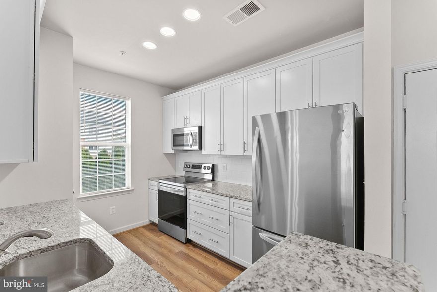 Welcome Home to this beautifully UPDATED 1-bedroom, 1-bathroom condo in the heart of highly desirable Brambleton. SUPER cute, bright open floorplan with an abundance of natural light, this home is both stylish and functional — perfect for modern living!

Enjoy a recently renovated kitchen featuring crisp white cabinetry, gleaming granite countertops, and stainless steel appliances. Washer and Dryer in Unit! Fresh paint and brand-new carpet throughout make this unit completely move-in ready. Step outside onto your private deck, where you can sip morning coffee or unwind while overlooking peaceful common areas.

This condo offers fantastic amenities including Verizon FIOS internet and basic cable included in rent, plus access to a private community pool, gym, car wash, and more. Located just across the street from the Brambleton Town Center, you’ll have shopping, restaurants, the local library, seasonal farmers market, and live entertainment just steps away. Outdoor enthusiasts will love the nearby tennis and volleyball courts, walking/jogging/biking paths, and easy access to commuter parking and rush hour bus service — all within approximately a mile.

Don't miss your chance to live in one of Loudoun County’s most vibrant communities. Schedule your showing today!