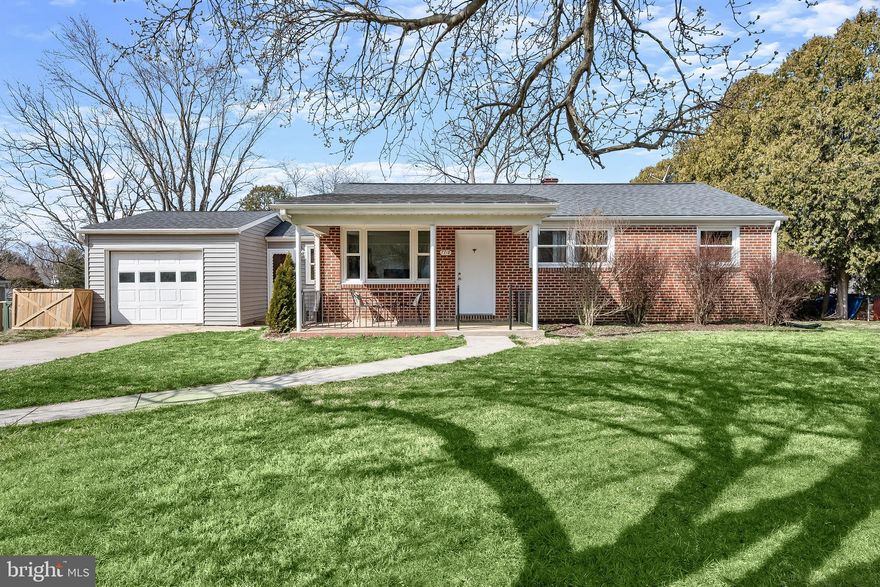 Step inside to find light-filled interiors enhanced by a neutral color palette and hardwood
floors that add warmth and character throughout. The spacious living room with a picture window is at the front
of the home and sets the stage for relaxation, while the adjoining dining room with crown
molding creates a perfect setting for gatherings and meals.
The galley kitchen offers everything you need to cook with ease, featuring an
electric cooktop, built in oven, paneled French door refrigerator, double sink, and dishwasher. An adjacent 
mud room provides convenient access to the one-car garage, offering both
storage and practicality.
The main level continues with three comfortable bedrooms and a full bath highlighted by
a classic tile tub-shower combination. Downstairs, discover a versatile recreation room,
a second full bath with a large walk-in shower, a dedicated storage area, and a
workshop, ideal for hobbies or projects.
Outdoor living is equally inviting with a charming covered front porch and a private
backyard retreat that backs to trees, complete with a storage shed. Recent updates
include a new electric HVAC system (2022), ensuring modern comfort.
Set in a tranquil neighborhood yet close to shops, dining, and all that Sykesville has to
offer, this home delivers the perfect balance of charm, convenience, and comfort.