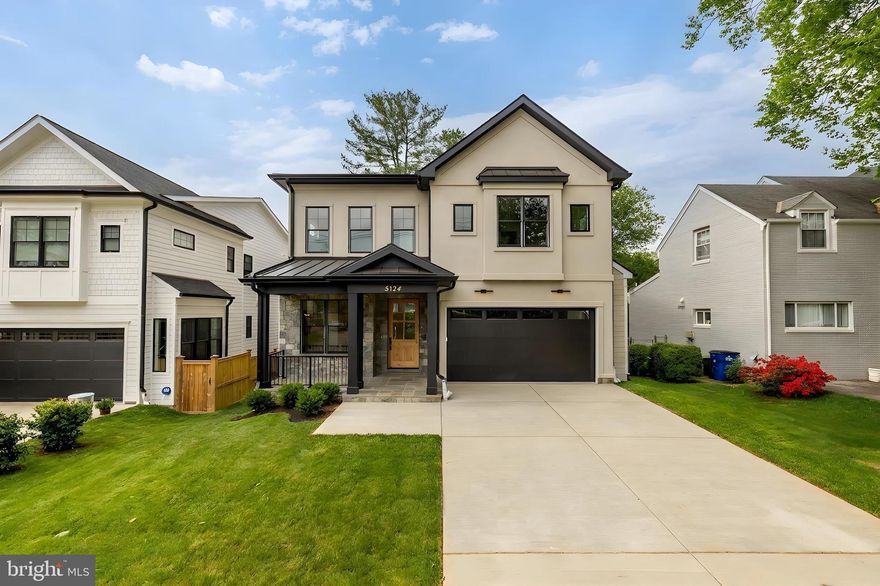 Welcome to 5134 Newport Avenue, a beautifully crafted new construction home offering a thoughtfully designed floor plan and seamless indoor-outdoor living, set on a quiet, tree-lined street in close-in Bethesda.

A welcoming front porch leads into light-filled interiors featuring wide-plank hardwood floors, tall ceilings, and oversized windows throughout. The formal dining room is detailed with chair-rail wainscoting, a tray ceiling, and designer lighting, creating an elegant setting for entertaining. The expansive living and family room is anchored by a fireplace with custom millwork and opens directly to the rear deck through a wall of glass, blending indoor and outdoor living with ease.

The gourmet kitchen is designed for both function and style, complete with an oversized island, double-stacked cabinetry, stainless steel chef-grade appliances including a gas range and double wall ovens, and custom pendant lighting. The adjacent deck offers a gas line for grilling or a fire feature and overlooks the landscaped backyard.

The main level is completed by a walk-in pantry, mudroom, powder room, and direct access to the two-car garage.

Upstairs, four bedrooms include two en-suite layouts and a well-appointed buddy bath, all with generous closet space and hardwood flooring. The primary suite serves as a private retreat, featuring dual walk-in closets with custom organizers and a spa-inspired bath with an oversized glass-enclosed shower, dual vanities, a soaking tub, and refined finishes throughout. A spacious laundry room with cabinetry and sink completes the upper level.

The walk-out lower level offers exceptional additional living space, including a large recreation room with direct access to the patio and yard, a wet bar area, a fifth bedroom with legal egress, a full bathroom, and a versatile bonus room ideal for a gym, media room, or office.

Ideally located just moments from everyday conveniences and destination shopping and dining, including Bethesda Row, Strathmore, and Whole Foods Market, with easy access to downtown DC, NIH, and Walter Reed.

A refined new construction offering combining design, scale, and location.