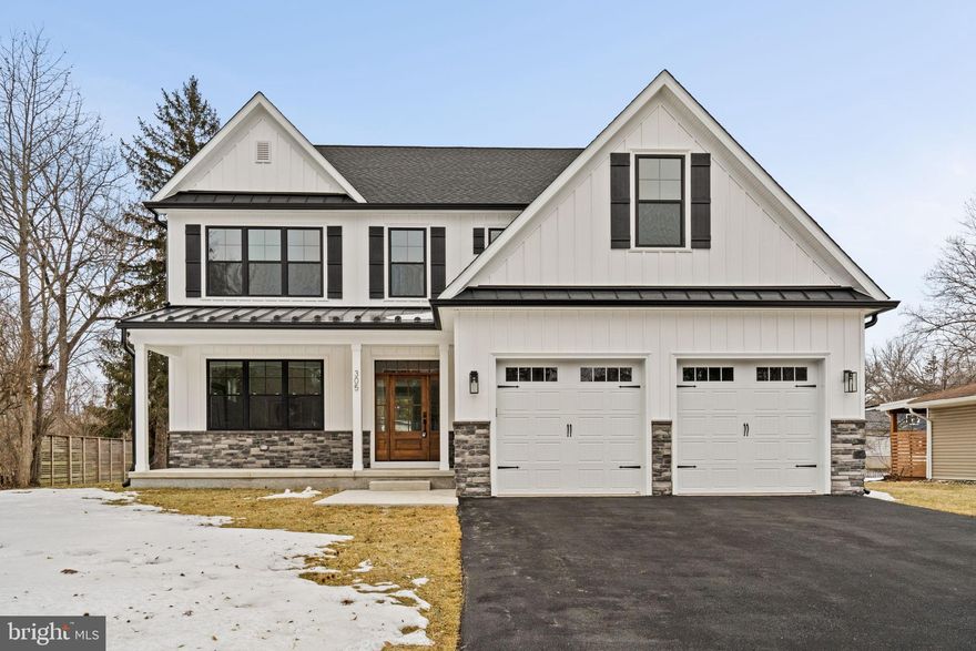 Discover this stunning new construction home set within one of Erdenheim’s most desirable established neighborhoods. Tucked away in a private setting surrounded by mature trees and professional landscaping, this home offers the perfect blend of modern luxury and timeless neighborhood charm. Located in the highly regarded Springfield School District.

Inside, solid red oak hardwood flooring flows throughout the home, complemented by a gas fireplace and a formal dining room ideal for entertaining. Enjoy outdoor living on the covered deck overlooking the private backyard, or unwind on the welcoming front porch—perfect for morning coffee or casual conversations with neighbors strolling by.

The kitchen is truly the heart of the home and designed to impress. It features GE Café appliances, a custom dry bar with beverage center, and a spacious island with seating for five—ideal for hosting gatherings. Two-toned countertops of white quartz and black leathered granite pair beautifully with custom white oak cabinetry, while a walk-in pantry provides exceptional storage.

The primary suite is a true retreat, offering a spacious bedroom, 2 massive walk-in closets with custom shelving systems, and a spa-inspired bathroom. The luxurious bath includes a large walk-in shower, dual vanity, and soaking tub. An upstairs laundry room adds everyday convenience.

The fully finished basement offers endless possibilities, including space for a game room, family room, home theater, bar, or home gym. An additional bedroom and full bathroom make it perfect for guests or extended family. This exceptional home delivers luxury, privacy, and flexibility in a premier Erdenheim location—an opportunity not to be missed.