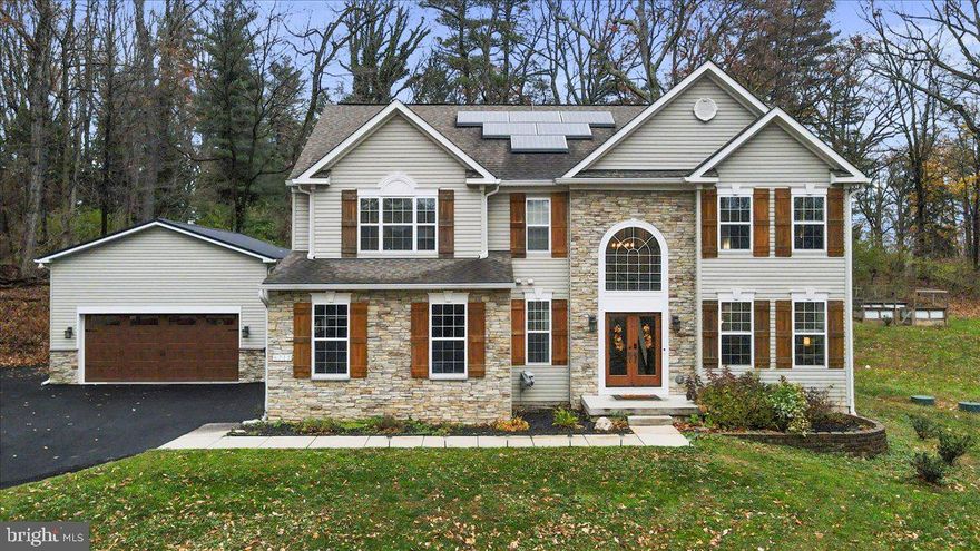 Check out this amazing home on a private, wooded lot just minutes from I-270 and shopping, this dream retreat combines nature, luxury, and convenience. With an extensive outdoor entertaining area, a detached second garage for hobby enthusiasts, and a second bedroom suite with a full bathroom, this home is designed to check every box.

In addition to the spacious primary bedroom suite, the layout offers valuable flexibility, highlighted by a luxurious secondary bedroom suite—perfect for extended guests or a private work-from-home sanctuary. This second bedroom includes its own full bathroom, creating a true private suite experience.

Step outside and discover one of the home’s standout features: an expansive multi-level deck crafted for both relaxation and entertaining. Enjoy a covered seating area w/ heater for year-round use along with a covered bar and grilling station that functions like your own private outdoor lodge. Step down to the patio and gather around your firepit with friends. Whether hosting or winding down quietly, this outdoor space delivers.

Car enthusiasts and hobbyists will love the impressive garage setup. In addition to the attached 2-car garage with EV 240 outlet, the property includes a separate 2-car detached garage—ideal for a personalized workshop, weekend projects or vehicle storage. Wired with a 50-amp breaker and ready for a lift, it’s perfect for restoration work, woodworking, or equipment storage. An adjacent parking pad adds even more versatility, easily accommodating an RV, boat, or trailer with outdoor exterior 240 outlet.

Inside this custom built 4 bedroom home you’ll find a spacious interior with refined fixtures and thoughtful upgrades throughout. The traditional floor plan features a spacious living room and formal dining room—ideal for hosting gatherings and celebrations. At the heart of the home, the updated eat-in kitchen includes stainless steel smart appliances, an expansive center island, and rich granite countertops. Just off the kitchen, the cozy living room invites you to unwind by the wood-burning stone fireplace, which flows effortlessly into the outdoor entertaining area.

Upstairs, discover four generously sized bedrooms, three full bathrooms, and convenient upper-level laundry. The primary suite is a true retreat, featuring a vaulted ceiling, oversized walk-in closet, and a spa-inspired bathroom with dual vanities, a soaking tub, and a separate stall shower. The second bedroom suite includes its own full bathroom, while the third and fourth bedrooms share a pass-through bathroom.

The expansive unfinished basement offers endless potential—create a home theater, gym, recreation room, or workshop tailored to your needs. Rough-in plumbing is already installed for an additional bathroom.

The outdoor area also includes fenced raised garden beds with a built-in watering system and a large storage shed for all your tools and equipment.