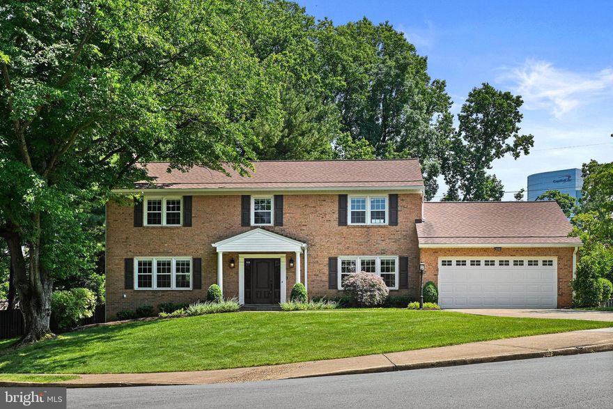 Welcome to this beautifully renovated 5BDR |  3.5-BATH brick colonial in the desirable McLean Hamlet! With a PRIVATE & FLAT yard, a 2-car garage,  just 1 block to Falstaff Park, and across from the Spring Hill Elementry bus stop -  this home offers both elegance and practicality.

Step inside to discover a stunningly designed kitchen featuring a stylish backsplash, a center island with a microwave, a dishwasher, a smart fridge with an ice maker, recessed lighting, gas stove, kitchen table space, and ample white cabinets and countertops. The separate living room and dining room comfortably accommodate guests, and the family room features a cozy fireplace and access to a large deck. The main level also includes a convenient half bath and a practical mudroom/laundry room with garage access.

Moving to the upper level, you'll find hardwood floors throughout. The owner suite offers a ceiling fan, a large walk-in closet with custom shelving, and an office nook. The renovated owner's bath is a spa-like oasis with a double sink vanity, a frameless glass door shower, and a freestanding tub. The 2nd, 3rd, and 4th Bedrooms are nicely sized with spacious double door closets, ceiling fans, and abundant natural light. The renovated hallway bath features a double sink vanity and a shower/tub combo.

The walk-up rec room is a versatile space with windows that bring in natural light, recessed lights, a stunning stone accent wall with a 3rd fireplace, and a bar area with a wine fridge. There's a large gaming area and TV area, perfect for entertaining and creating lasting memories with family and friends. The 5th bedroom has recessed lights and walk-up access to the patio, making it an ideal private guest suite. The 3rd full bathroom features a frameless glass shower. The utility room provides additional storage options. 

The well-maintained 0.39-acre private and flat lot features a fully fenced yard, large deck, and patio, providing ample space for outdoor enjoyment.The McLean Hamlet community offers a wonderful lifestyle with tree-lined streets, sidewalks, and streetlights, creating an ideal environment. Optional membership to the McLean Hamlet Swim & Tennis Club provides access to a range of activities for all ages, including swim teams, tennis teams, social events, and more.