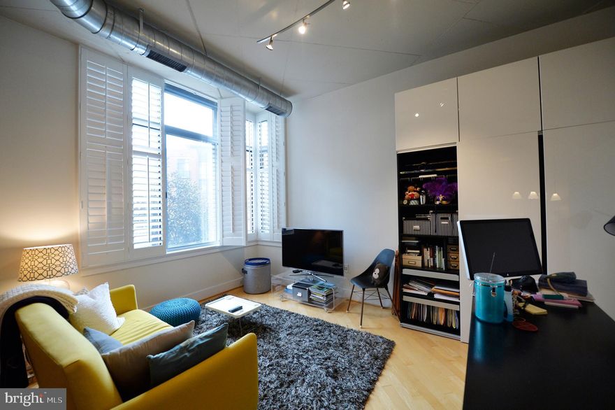 Developed by PN HOffman, Stunning 1 LARGE br is modern & open. Enjoy neutral decor, wood floors, granite bath & kitchen, SS apps, W/D, garage space, high ceilings and more. Southern exposure fills the home w/light. Above great retail & blocks to King St metro, shops, restaurants, AMC movies, Whole Foods & PTO. Wegmans coming soon! Enjoy courtyard, security & staffed desk. Pool & gym available for a low monthly fee.