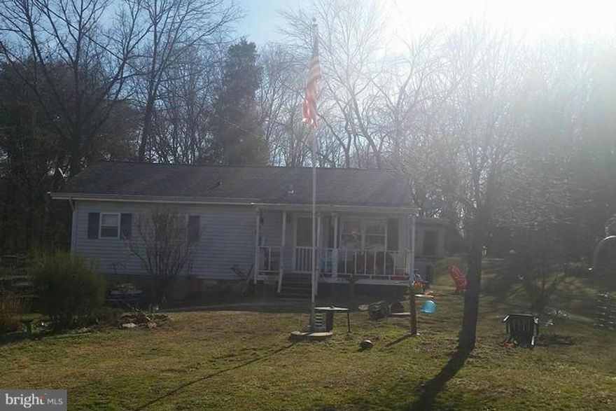 Almost an acre ( .718 acre) of land in Lake Ridge. The house located on the property being sold as-is, value is primarily in the land. The house is habitable (the owner still lives there) Close to commuter lots, VRE, shops, Old Bridge Rd, 95, Rte 1, RTE 123. House has 3 bedrooms 1.5 bathrooms. Property next to it is zoned M-2 & B-1