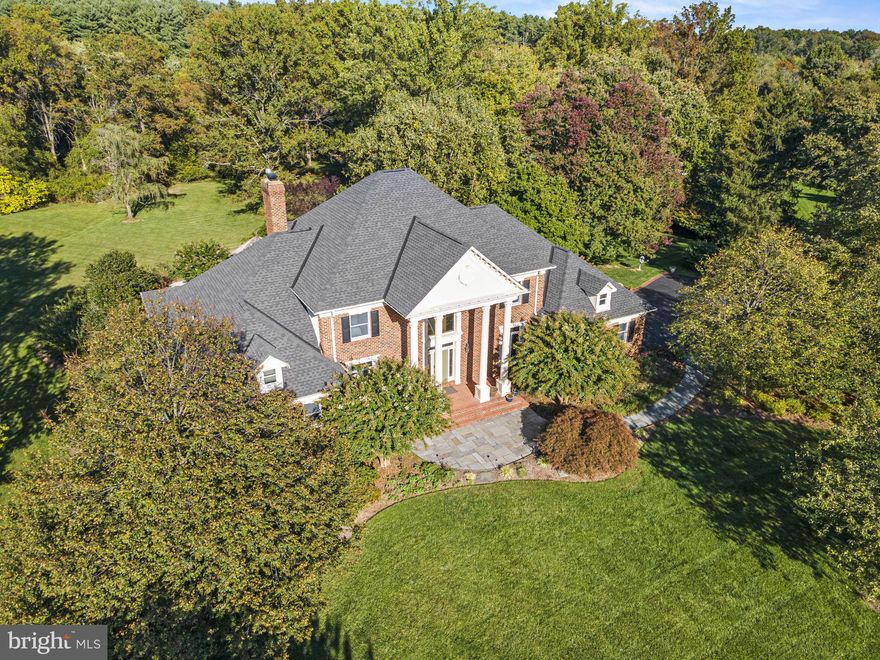 Welcome to estate living in the exclusive Dunrobin community on 3.3 acres of your new private oasis, just a short distance to downtown Leesburg. A collection of just 16 custom homes, the Dunrobin community offers unrivaled privacy in a peaceful setting that's close to everything but feels far from the hustle of everyday life. <br><br>

This expansive estate home offers 5 bedrooms including a main-level primary suite with four bedrooms upstairs, and a finished walkout lower level leading to the professionally landscaped private backyard with patios, a covered gazebo, a fish pond, a perfect fire pit setting, irrigation system, and so much more. The main level features refinished hardwood floors throughout, a covered rear porch off the kitchen and great room, and a screened porch at the primary suite. New carpet upstairs in the four bedrooms, all with direct access to shared bathrooms, plus a bonus loft space waiting to become your craft room or an ideal playroom. Downstairs the walkout lower level has updated LVP flooring, a large wet bar, two offices or dens, a cozy stove and TV space, and a large storage area.<br><br>

Surrounding the home is a private, stunning yard of over three acres backing to a small stream with scattered mature trees for plentiful shade. Relax on the patio, be soothed by the gurgling fish pond, toss another log on the fire, or stroll the grounds of your beautiful estate. Discover this expansive home and you'll connect to everything this gorgeous property has to offer.<br><br>

*Updates include: New roof in 2019. Wood floors refinished. New carpet upstairs & downstairs. Newer LVP downstairs. Kitchen appliances replaced.*