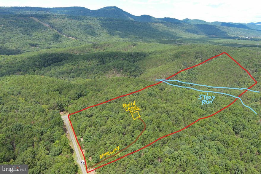 BOX CHECKER....23 WOODED ACRES THAT'S SURE TO CHECK EVERY BOX ON YOUR WISHLIST: PRIVACY.....LOCATED AT END OF A DEAD END ROAD WITH NO NEIGHBORS IN SIGHT. VIEWS.....TAKE YOUR PICK, ABOVE AVERAGE MOUNTAIN VIEWS TO THE EAST AND NORTH. WATER....."STONY RUN" FLOWS THROUGH THE PROPERTY MOST OF THE YEAR AND THERE'S AN AWESOME WATERFALL! USABILITY......8 ACRES OF PERFECTLY FLAT GROUND ON TOP BEFORE IT DROPS DOWN INTO WIDE HOLLOW WITH MULTIPLE COVES,  WITH A LITTLE DOZER WORK YOU COULD HAVE AN ATV PARADISE. READY TO ENJOY......700 FT DRIVEWAY INSTALLED TO CAMP/BUILD SITE WITH OBSERVATION DECK & CUTE OUTHOUSE, 15K WORTH OF INFRASTRUCTURE ALREADY COMPLETE, ALLOWING YOU TO START ENJOYING THIS PROPERTY  FROM DAY 1. POWER & PERKED.....HUNT, SHOOT, HIKE, ATV'S, CAMP OR BUILD....ONLY 2 MILES OFF THE PAVED ROAD WITH NO TREACHEROUS ROADS OR MOUNTAINS TO CLIMB....EASY IN...EASY OUT....LOCATED IN THE PRESTIGIOUS 10,000 ACRE GATED COMMUNITY ASHTON WOODS, A ONE OF A KIND PLACE, WHERE YOU CAN ESCAPE THE WORK & WORRY OF THE BIG CITY AND TICKLE ALL YOUR OUTDOOR FANCIES....10 MINUTES OFF 4 LANE SUPER HIGHWAY, 10 MINUTES FROM MULTIPLE PUBLIC ACCESS POINTS ON THE SOUTH BRANCH OF THE POTOMAC RIVER, 15 MINUTES FROM MOOREFIELD, 45 MINUTES FROM SKI RESORTS, 10 MINUTES FROM PRIVATE COMMUNITY ACCESS TO NATHANIEL MOUNTAIN WILDLIFE MANAGEMENT AREA 10,000 ACRES OF PUBLIC HUNTING & HIKING.....IF YOU LIKE THE OUTDOORS, YOU'LL NEVER RUN OUT OF THINGS TO DO.....WHO KNEW? ALL OF THIS WITHIN 2 HOURS OF DC.....BELIEVE IT! COME SEE FOR YOURSELF! THIS DECISION WILL BE EASY, IT'S A NO BRAINER!