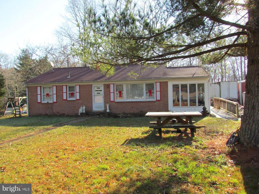 Brick rambler on 2 acres features hardwood floors, sun room with baseboard heat, deck and detached garage. Additional features include master bedroom with large attached bath, full unfinished basement and shed with electric.