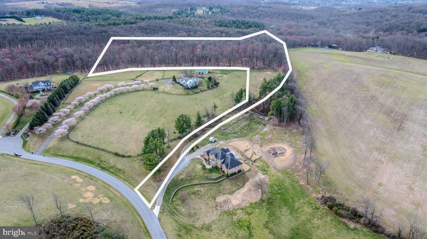 This gorgeous 18 acre lot wooded lot could be the site of your future dream home. Beautiful mature forest. The 7 gallon per minute well is in place, and it is perk approved for 4 bedrooms. Ready to build! Situated in an area of upscale housing, the house location offers quiet privacy. This is truly a once in a lifetime opportunity.
There is fee simple access to the lot over a shared driveway. The driveway maintenance agreement is spelled out on the plat. Please respect the neighbors privacy and don't drive back to the lot without showing permission. Conveniently located close to shopping, restaurants and commuter routes.  This property feels remote, yet is close to everything. House/lot packages available with one of our preferred builders or bring your own builder.
The current proposed path of the Maryland Piedmont Reliability Project crosses the southeast corner of this lot.  It is currently expected that MPRP will desire a right-of-way across the property. Buyer is responsible to perform due diligence as to what that might look like. Please consult the website for MPRP.