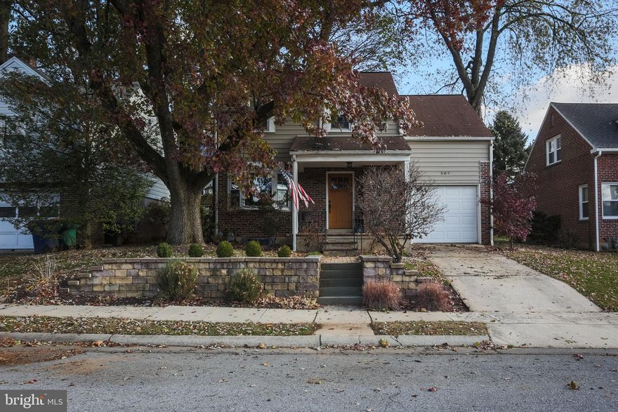 Welcome to this Wilson Schools Winner! From the curb appeal to the finished basement. This home has it all.Picture yourself relaxing on the covered front porch. Enter through the eye catching front door to the large living room with beautiful oak hardwood floors and brick fireplace. Updated energy efficient bay window brings in the natural light. Move onto the bright dining room with chair rail and hardwood floors. From there to  the nicely updated kitchen with tile back splash and matching tile floor. Conveniently off the kitchen is an updated powder room. Through the large 1 gar garage  you can gain entrance to the finished lower level family room with laminate floors laundry room and plenty of storage. The fenced in back yard has a large deck for summer time entertaining.The open oak staircase leads to the upper reaches and a large master bedroom with walk in closet and access to the large attic for storage. The second level also has 2 generously sized bedrooms all with beautiful oak hardwood floors.  Finish this level off with an updated full bath.  The home also has high efficiency gas hot air heat and Central Air.  This property won't last long so come see it today.