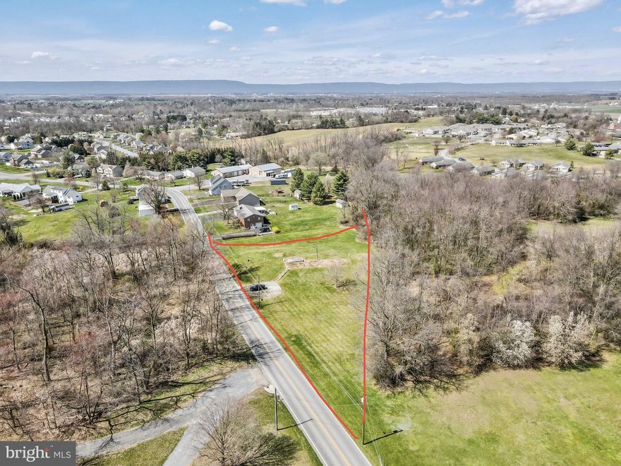 Beautiful location and setting for this nice chunk of land.   With 1.8 acres, and all utilities, all you have to do is pay the connection fee.  This lot is ideal for any type of home.  Build your dream home and enjoy the views. 
There was a mobile home on this lot, that has recently been torn down.   Feel free to take a ride by, get out and walk around.  Climb the steps and picture yourself sitting on the front porch of your dream home.  Desirable area!  Definitely a MUST SEE!