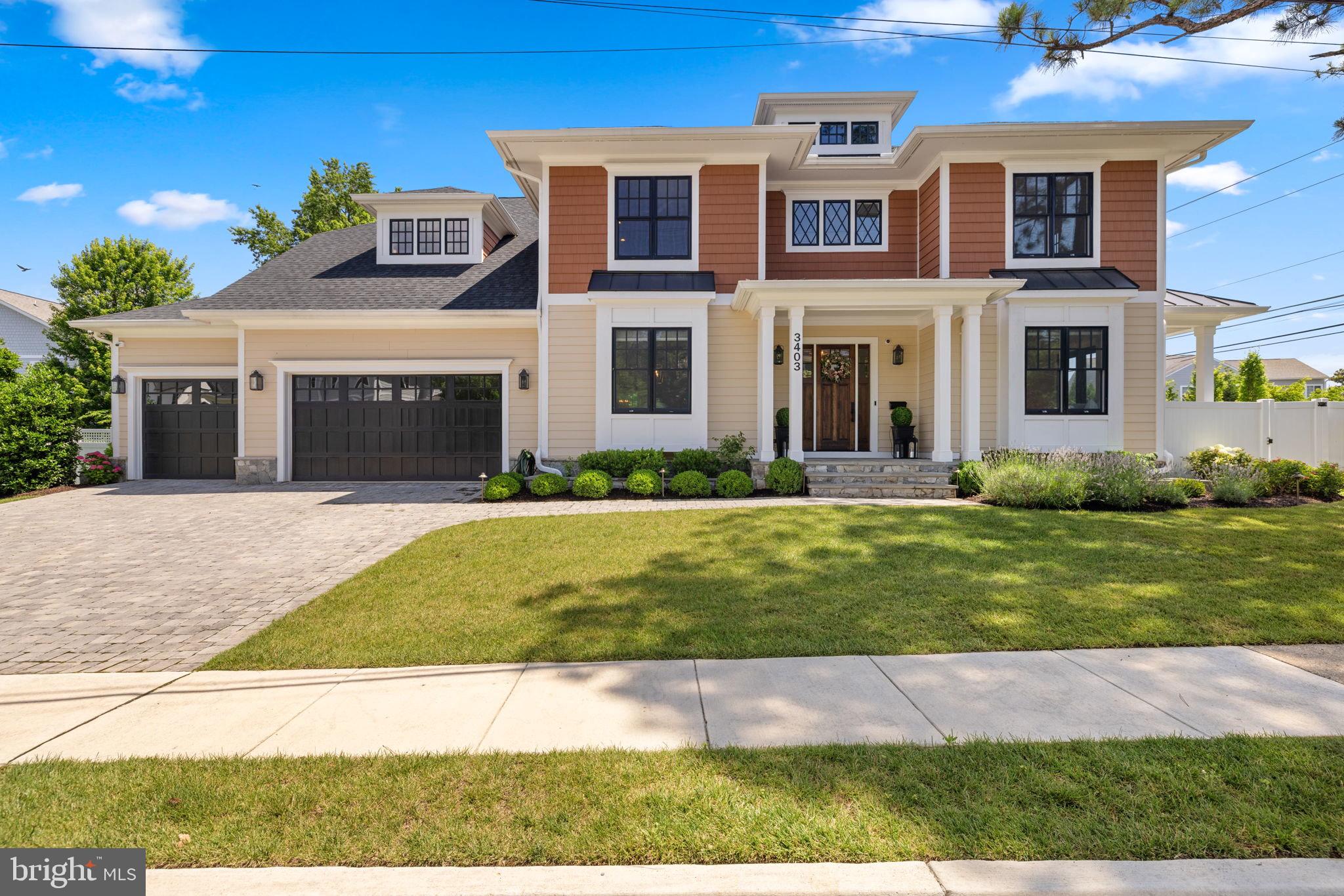 Better than new in Williamsburg Village! Built by MR Custom Homes four years ago, this beautifully-designed, turnkey home offers three levels of light-filled living spaces, gorgeous outdoor hardscaping and plantings, and a three-car attached garage. With designer finishes, fixtures, hardware and tile, custom window treatments, elegant moldings, hardwood floors, a built-in speaker system, full security system and a whole-house generator, this is truly a special offering.
Inside, the main level features ten-foot ceilings with a foyer flanked by both the dining room on one side and the living room with a porch on the other. There is a large family room with a coffered ceiling, a gas fireplace and access to the screened-in porch with an outdoor stone-surround gas fireplace, infrared heaters and built-in outdoor speakers. Opening to the family room, the eat-in kitchen features marble countertops, a large island with seating, top-tier appliances, a butler's pantry with an Avalon wine cooler connecting to the dining room and a pot filler faucet over the range. The mudroom is accessed through the kitchen, providing cubby storage, as well as access to both the walk-in pantry and the attached three-car garage. There is also a study/fifth bedroom suite with built-ins, a walk-in closet and an en suite full bathroom, along with a powder room on this level. Upstairs, the primary suite provides dual walk-in closets and a spa-like primary bath with dual vanities, a seamless glass shower, a free-standing soaking tub, a private water closet and a linen closet. Three additional bedroom suites, a bedroom-level laundry room and finished storage complete this level.
The lower level offers an expansive recreation room with a wet bar with a beverage cooler and access to the backyard. Additionally, there is a sixth bedroom with direct access to the full bathroom, an exercise room, a theater room, an utility room and multiple storage closets.
The fully-fenced backyard is lushly landscaped with mature plantings including hydrangeas, roses and lavender, as well as tall evergreens for added privacy. An ideal location that is a short walk to Discovery Elementary School, Williamsburg Middle School and Yorktown High School, it's a quick drive to DC and Tysons.