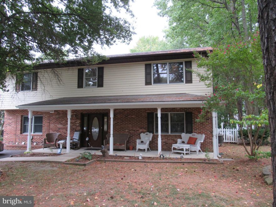 Tranquil living in the water privileged community of Bay City. Move right into this pristine 4 bedroom, 2 bath home. Entertain in the large, open family room. Main level living area features a pellet stove and water lines for a wet bar. Deep lot, with room for the RV and boat, 2  sheds, fire pit, covered patio & deck. Newer appliances. Potential for in-law suite. Public Sewer and Water.