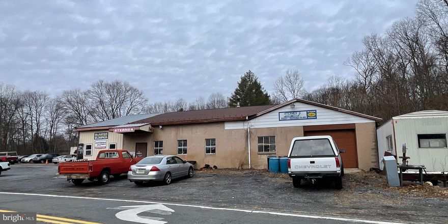 3 Income Producing Buildings... Service Garage has a front and rear lot for approx. 50 cars, 2 - 10 ft garage doors and 1 - 12 ft door. The Garage is 51x44, serviced with waste oil heat and forced hot air. The lift is owned by the tenant but could be separately negotiated, tenant pays $1,000 per month for rent. Additionally, the White House has 3 bedrooms, 1 full bath and has its own kerosene heat, tenant pays heat and electric. and pays $1,000 per month for rent. The roof will be replaced by the end of June. Auto garage tenant pays the trash for the 3 buildings. The mobile home tenant pays their own heat and electric as well as $700.00 per month for rent.  The well is shared, each building has its own septic and electric meters. Total current income is $2,700 per month. The Auto Repair Shop Business is available to purchase seperately . Call listing agent for more info.