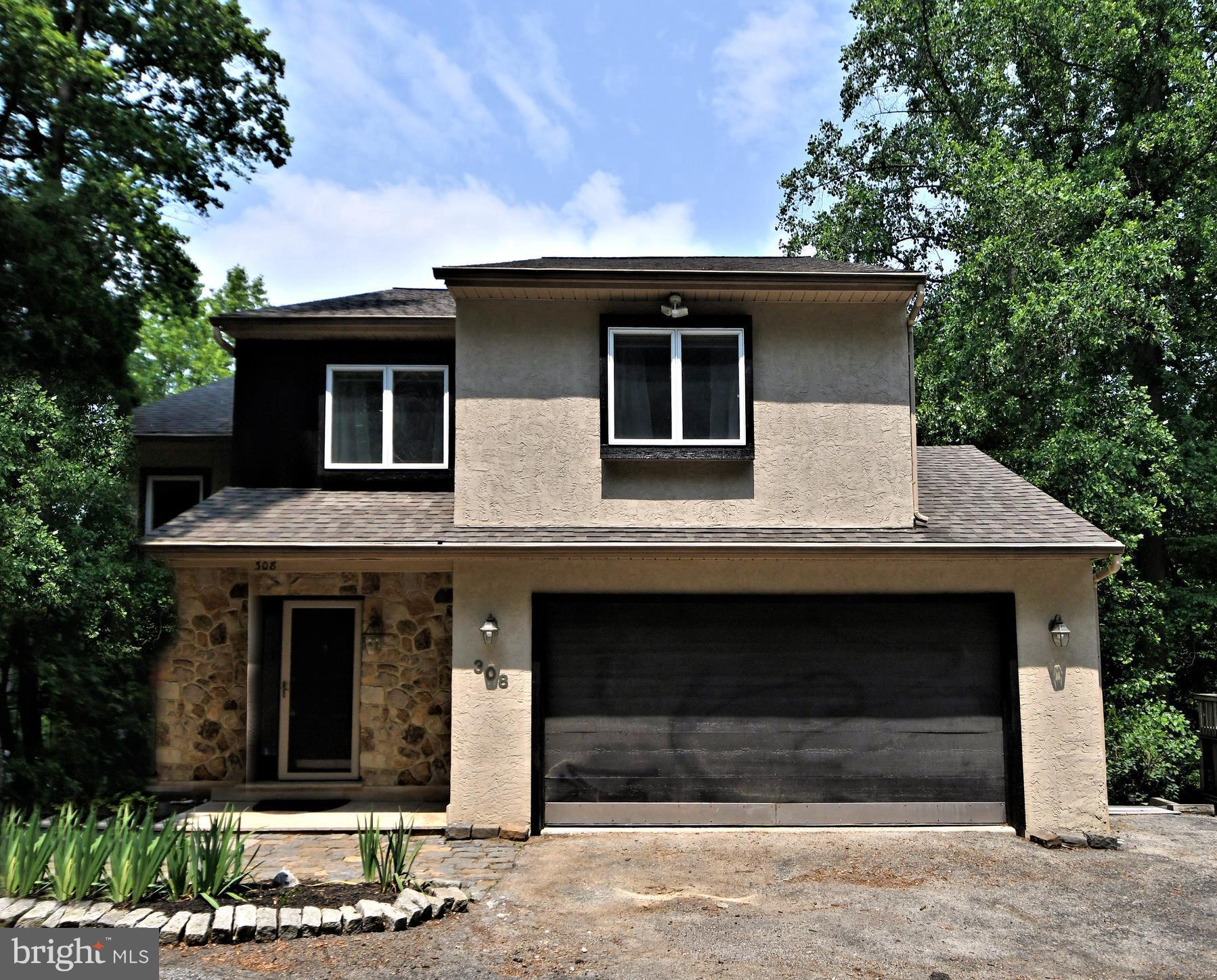 Tucked into the quiet hillside of West Conshohocken, just minutes from the Main Line and Center City, 308 Balligomingo Road is not just a home — it’s your private sanctuary. Thoughtfully designed for those who demand more from life, this 3,362 sq ft, 4-bedroom, 4-bath retreat delivers the elegance of a high-end resort with the warmth of a forever home. A Home That Breathes With Nature. Set on over half an acre of lush, wooded landscape, your backyard is not just a yard — it’s an ecosystem. A gently flowing creek hugs the property’s edge. Multi-tiered Brazilian hardwood decks float above it all, while a saltwater pool, cascading waterfalls, firepit, and hot tub create a fully immersive outdoor experience. It’s peace you can feel.
A Culinary Space That Inspires Inside, the gourmet chef’s kitchen features custom maple cabinetry, soapstone countertops, and premium stainless-steel appliances, including a professional-grade gas range. Entertain effortlessly in the adjacent dining and living areas, where vaulted ceilings, Lyptus hardwood floors, and a dramatic floor-to-ceiling stone fireplace create a warm yet sophisticated atmosphere.
Retreat-Level Living. The primary suite is a masterclass in serenity: private balcony, spa-like bath, walk-in closet, and a view framed by trees and sky. Two additional upstairs bedrooms offer comfort and charm, while a fully finished lower level opens directly to the backyard — ideal for a guest suite, office, or au pair quarters. Effortless Access. Uncompromised Privacy.
Despite its resort-like feel, 308 Balligomingo is minutes from everything — King of Prussia, Conshohocken, major rail lines, and the Schuylkill Expressway. Zoned to award-winning Upper Merion Schools, this is a location that works as hard as you do — and rests even better.
All this privacy, yet you are so close to major routes like Turnpike, 276, 476, 76, 422, 202, 30, 320 and multiple train stations. Only minutes to Center City Philadelphia, Wayne, Villanova, King of Prussia and Conshohocken. Convenient two car attached garage and driveway parking. Easy to Show