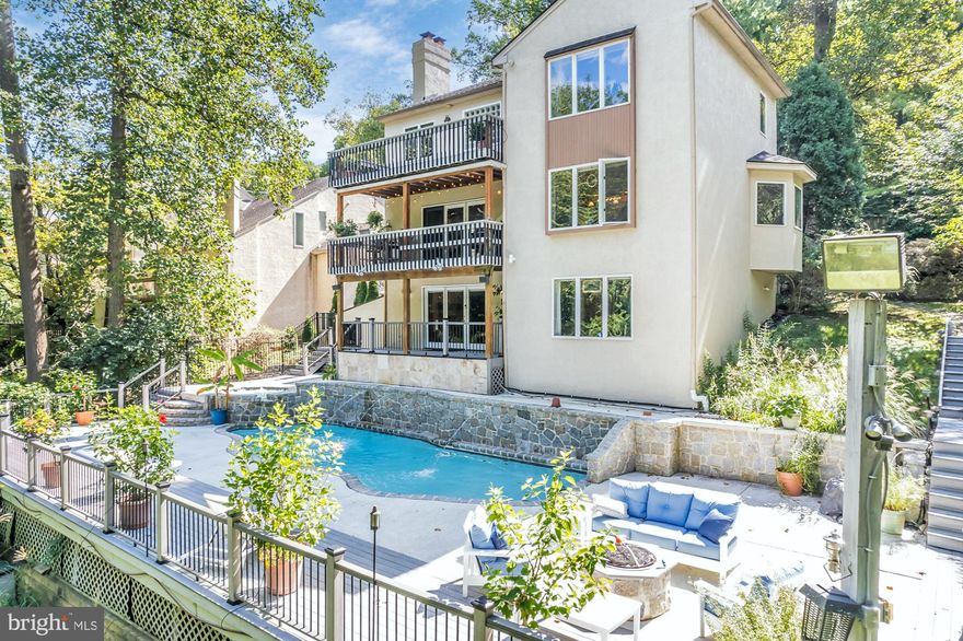 Tucked into the quiet hillside of West Conshohocken, just minutes from the Main Line and Center City, 308 Balligomingo Road is not just a home — it’s your private sanctuary. Thoughtfully designed for those who demand more from life, this 3,362 sq ft, 4-bedroom, 4-bath retreat delivers the elegance of a high-end resort with the warmth of a forever home. A Home That Breathes With Nature. Set on over half an acre of lush, wooded landscape, your backyard is not just a yard — it’s an ecosystem. A gently flowing creek hugs the property’s edge. Multi-tiered Brazilian hardwood decks float above it all, while a saltwater pool, cascading waterfalls, firepit, and hot tub create a fully immersive outdoor experience. It’s peace you can feel.
A Culinary Space That Inspires Inside, the gourmet chef’s kitchen features custom maple cabinetry, soapstone countertops, and premium stainless-steel appliances, including a professional-grade gas range. Entertain effortlessly in the adjacent dining and living areas, where vaulted ceilings, Lyptus hardwood floors, and a dramatic floor-to-ceiling stone fireplace create a warm yet sophisticated atmosphere.
Retreat-Level Living. The primary suite is a masterclass in serenity: private balcony, spa-like bath, walk-in closet, and a view framed by trees and sky. Two additional upstairs bedrooms offer comfort and charm, while a fully finished lower level opens directly to the backyard — ideal for a guest suite, office, or au pair quarters. Effortless Access. Uncompromised Privacy.
Despite its resort-like feel, 308 Balligomingo is minutes from everything — King of Prussia, Conshohocken, major rail lines, and the Schuylkill Expressway. Zoned to award-winning Upper Merion Schools, this is a location that works as hard as you do — and rests even better.
All this privacy, yet you are so close to major routes like Turnpike, 276, 476, 76, 422, 202, 30, 320 and multiple train stations. Only minutes to Center City Philadelphia, Wayne, Villanova, King of Prussia and Conshohocken. Convenient two car attached garage and driveway parking. Easy to Show