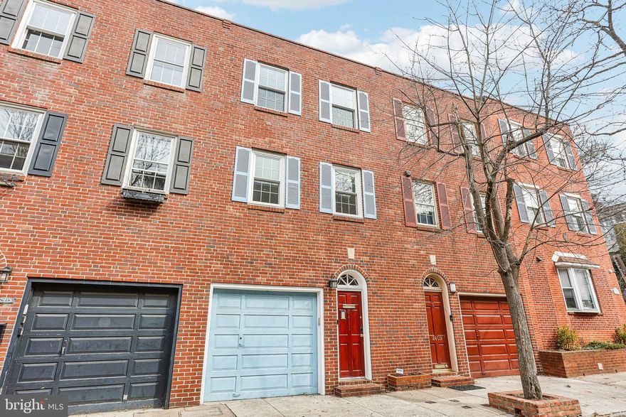 Charming 3 bed, 2.5 bath home in the coveted Fitler Square neighborhood and Greenfield Catchment with GARAGE PARKING, a large patio, hardwood floors throughout, and southern light exposure. As you enter the first level, you'll find a welcoming foyer with a coat closet, a full bathroom, and a versatile bedroom with fireplace and closet, ideal for a playroom, office or home gym. This level also includes a convenient laundry and utility room with access to the large back patio, perfect for outdoor entertaining. The second level features an open-concept living space with a cozy fireplace and two balconies. This space flows into the updated kitchen which offers ample cabinet and counter space, stainless steel appliances, and center island with bar seating. A half bath completes this level. On the third floor, you'll discover two additional bedrooms with spacious closets. The hallway full bathroom is renovated with a fully tiled bath/shower combo and oversized vanity with storage. Located just steps from Fitler Square Park, Schuylkill River Park, and popular spots like Cafe Lutecia and Rival Bros, this home is a short walk to PENN, CHOP, Comcast, Rittenhouse, and all of Center City.