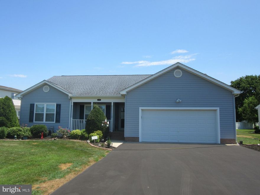 Beautiful home with one level living on large lot and 2 car garage with large paved driveway .  This well maintained home is flooded with natural light,  and features open concept in main living area.  Vaulted ceiling in living room and ample windows is most inviting.  Kitchen is spacious with plenty of cabinets and counter space and  has new refrigerator, dishwasher and garbage disposal.  Roof is newer and windows are all updated.   House is equipped with solar panels making it very efficient and low in energy costs.  The crawl space is insulated and has a dehumidifier.   Easy one floor living with convenient location, spacious yard,  and loads of updates.