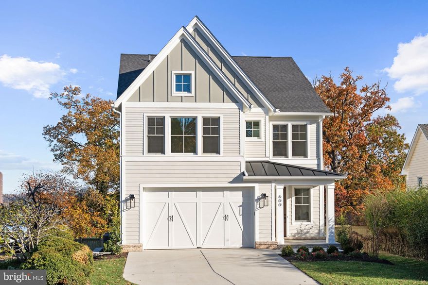 **Builder offering Financing Incentives - Interest rates starting as low as 4.5%, Builder assistance available for qualified buyers. Limited-time offer.**
Move-in Ready! A stunning new custom home by Classic Cottages, perched on a hilltop in Arlington’s sought-after Oakcrest neighborhood with sweeping views of National Landing.
WHAT MAKES THIS HOME STAND OUT?
This beautifully crafted residence blends modern design with timeless elegance, offering a layout that lives as well as it looks. The open-concept main level is designed for everyday comfort and effortless entertaining, highlighted by soaring 10' ceilings on the main level, wide-open sightlines, and abundant natural light.
The gourmet kitchen is a true showstopper, featuring upgraded cabinetry, upgraded quartz countertops, a large center island, and premium Thermador appliances, creating a space that’s equally suited for weeknight dinners or hosting a crowd. The kitchen flows seamlessly into the great room with a cozy gas fireplace and opens to a private patio — perfect for morning coffee, al fresco dining, or evening cocktails.
This home is built for comfort, efficiency, and long-term performance with a three-zone variable-speed high-efficiency heating and cooling system, premium Ply-Gem windows, and CertainTeed Landmark architectural shingles. Solid-core 8' and 7' doors throughout the home add to the upscale feel, while 220V electrical wiring in the garage provides easy future-ready car-charging.
Upstairs, the luxurious primary suite offers a spa-inspired bathroom and expansive walk-in closet, while two additional ensuite bedrooms with walk-in closets provide comfort and privacy. A convenient laundry room completes this level.
The upper loft level features a fourth bedroom, full bath, a bright lounge area with wet bar, and access to a private rooftop deck with sweeping views of National Landing and beyond — your new favorite sunset spot.
The fully finished lower level adds even more flexibility with a large recreation room, a bonus space perfect for a gym or home office, and a fifth bedroom with a full bath ideal for guests or multigenerational living.
A two-car garage, thoughtful storage, custom finishes throughout, and a Builder’s Warranty included complete this exceptional, move-in-ready home.

WHAT MAKES THIS LOCATION STAND OUT?
Ideally located near Crystal City and National Landing, this home offers exceptional walkability to neighborhood favorites including Commonwealth Joe Coffee Roasters, Makers Union, and Whole Foods. Enjoy effortless access to dining, coffee shops, and everyday conveniences just steps from your door. Outdoor lovers will appreciate nearby Long Bridge Park, Virginia Highlands Park, and the scenic Mount Vernon Trail along the Potomac, offering miles of walking and biking paths, open green space, and river views. A rare opportunity to enjoy a truly walkable lifestyle with easy access to both vibrant city amenities and beautiful outdoor spaces.

ABOUT THE BUILDER
Classic Cottages is a premier Northern Virginia custom home builder with more than 15 years of success and a reputation for quality, consistency, and exceptional client service. As a fully integrated firm, Classic Cottages manages every stage of the process — from land acquisition and architectural design to construction and warranty — ensuring a seamless and transparent experience. Buyers have the flexibility to build fully custom, personalize a semi-custom plan, build on their own lot, or purchase a move-in-ready home. Known for elevated finishes, thoughtful layouts, Classic Cottages delivers homes that consistently over-deliver on value, comfort, and livability.