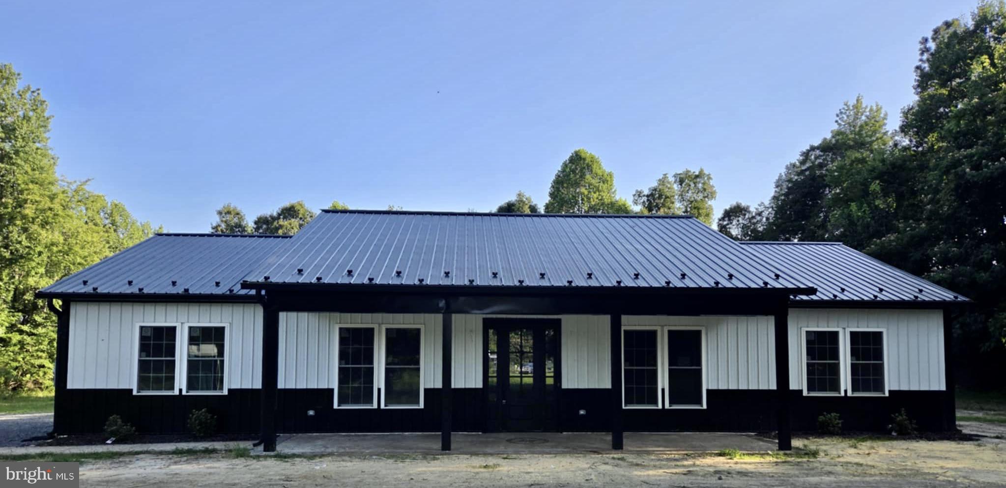 New Construction Ready now! Stunning and truly unique Barndominium on 1.34 acre lot. Amazing details through-out including shiplap, custom Knotty Alder cabinets, amazing granite counters, huge center island, built-in pantry cabinet, recessed lighting through-out, and open shelving framing the farmhouse kitchen sink. You will love the wide-open floor plan between the Kitchen/dining/living which showcases the gorgeous carpentry details. Split bedroom plan with Primary bedroom at one end and 2 additional bedrooms PLUS office\den at opposite end of home. Primary bedroom features HUGE walk-in closet, tiled shower, and dual farmhouse sinks. Hall bath also features dual sinks and 6 ft tub. Gorgeous stamped concrete flooring through-out entire home and extremely tasteful fixtures and lighting. You do not see craftsmanship and details like this every day! This home is a must-see! No HOA!