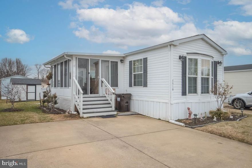 Back on the Market. Buyer did not perform. Welcome to 7516 Biscayne Bay Blvd! Discover easy, one-level living in this beautifully maintained three-bedroom, two-full-bath mobile home located in the desirable Biscayne Bay neighborhood. Step inside to a spacious living room with vaulted ceilings, upgraded lighting, and a charming bay window that fills the space with natural light. The built-in desk offers a perfect spot for work or study. The generous kitchen is a standout feature, boasting ample cabinet space, sleek stainless-steel appliances, and room for a dining table, making it ideal for both everyday meals and entertaining. Retreat to the private primary bedroom, complete with an ensuite bath featuring a tub/shower combination and a walk-in closet. Two additional generously sized bedrooms share a full bath, which includes a relaxing Jacuzzi tub. Unwind in the versatile sunroom—perfect as a three-season room—or step outside to enjoy the patio.  A convenient storage shed, and two-car parking add to the home’s functionality. As an added bonus, the sale includes the living room furniture (including two lamps, an area rug) and the lawnmower stored in the shed, making this home truly move-in ready. Park approval is required. Don’t miss your chance to call this wonderful property home—schedule your showing today!