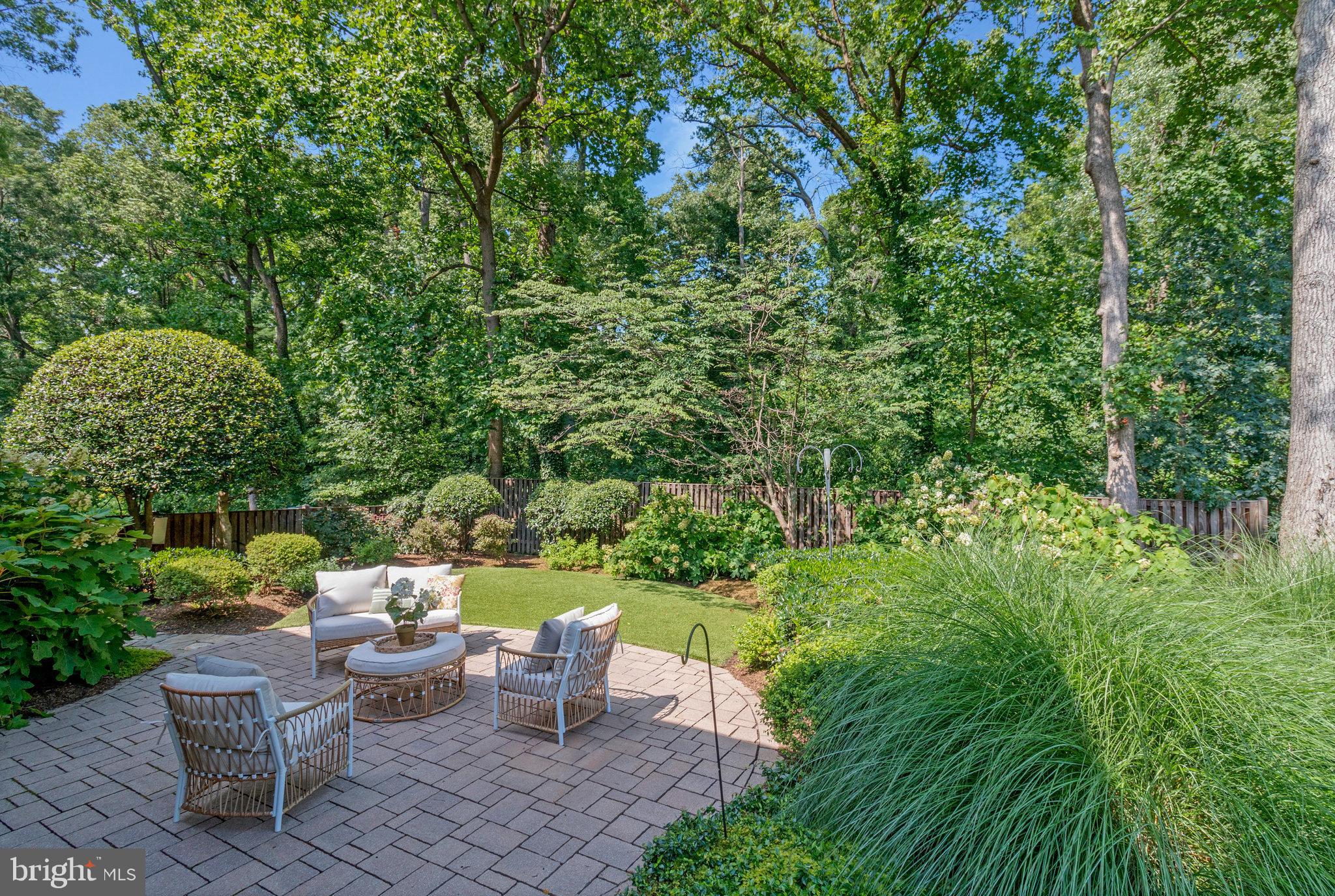 Winter Water Views in Villamay! Nestled along the scenic George Washington Parkway in the highly sought-after Villamay community, this charming raised rambler offers year-round beauty and unmatched convenience. Boasting 5 bedrooms and 3 fully updated bathrooms, this home is perfect for those who value space, character, and natural surroundings. Step inside and be welcomed by unique touches like recessed shelving that add a custom feel. The updated kitchen features stunning natural cherry cabinets that stretch to the ceiling, providing both elegance and storage. The living room offers peaceful, tree-filled views in the summer and seasonal views of the Potomac River in winter—best enjoyed by the warm glow of the gas fireplace. On the main level, you'll find four spacious bedrooms and two updated full baths, including a private ensuite primary bedroom. The lower level includes a large family room with a second gas fireplace surrounded by custom built-ins, and impressive 12-foot patio doors that open to a beautifully landscaped garden. The stone patio and wraparound steps make entertaining easy, connecting directly to the kitchen entrance. The fenced yard is ideal for pets or play, and the home includes extended drainage systems to manage rainwater effectively. The lower level also features a fifth bedroom with ensuite, a generous laundry room, and access to an oversized two-car garage with additional storage space. Ideally located just south of Old Town Alexandria, you’re minutes from shops, restaurants, Highway 495, and Reagan National Airport—truly a commuter’s dream. Villamay offers a welcoming neighborhood feel, with youth sports programs and proximity to the newly renovated Mount Vernon Community Center, which will include two ice rinks, a swimming pool, and fitness facilities. You'll also enjoy quick access to the Potomac River’s scenic hiking and biking trails, and you're just down the parkway from George Washington’s Mount Vernon estate. This is more than just a house—it’s a lifestyle in one of the most picturesque and connected communities in Northern Virginia. Don’t miss your opportunity to make this stunning property your next home!