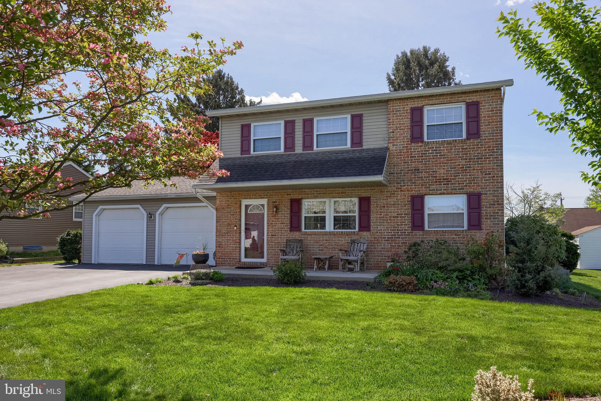 Perfectly located in popular Lampeter-Strasburg Schools! Located on a low traffic street, this home sits on a generous home site, and is a gardeners delight. Walk inside of this custom home to find beautifully restored wood plank flooring. The kitchen boasts recessed lighting, plenty of cherry wood cabinets, a large kitchen island, modern appliances, and a built in desk space. The kitchen opens to a large 4 season room with cathedral ceilings, exposed beams and plenty of windows that bring in the natural light. The main floor also has a large laundry room, 1/2 bath, and a bonus room which makes for a great office or flex space. Upstairs, you will find three generous bedrooms, and a lrecently renovated full bath with LVP flooring, updated shower and a double vanity. The finished lower level boasts a large family room, and a utility room that can make a great workshop with bilco door for easy access. The attached 2 car garage has attic space access, and is oversized for extra storage. The home is equipped with cool central air, energy efficient propane heat, and solar panels for very low electricity costs. Outside, enjoy birdwatching, BBQ grilling, or sipping morning coffee on the front porch or the back patio swing. The back yard is shaded and has a very private feel. Walk to parks, and easy commutes to schools, shopping and healthcare! Put this home on the short list and call for your private showing today!