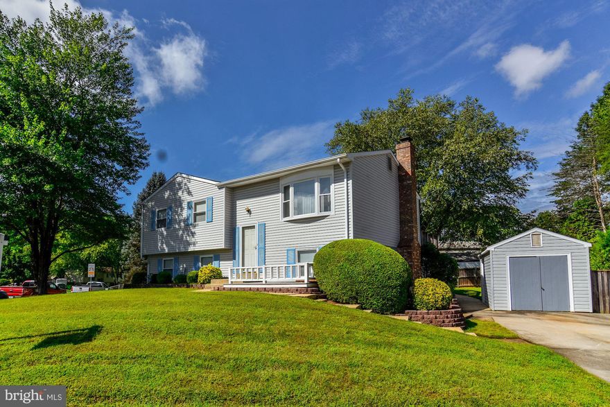 Beautifully renovated kitchen w 42 inch raised panel cabinets & granite counters, baths w tile surround-built in seats and shelves, large table space in kitchen, deck off kitchen w stairs to patio, fully fenced in yard, large drive in shed (perfect for motorcycles)with concrete flooring and elect at driveway level, extra shed for lawn tools, private master suite on main lv, 2nd master on U1..