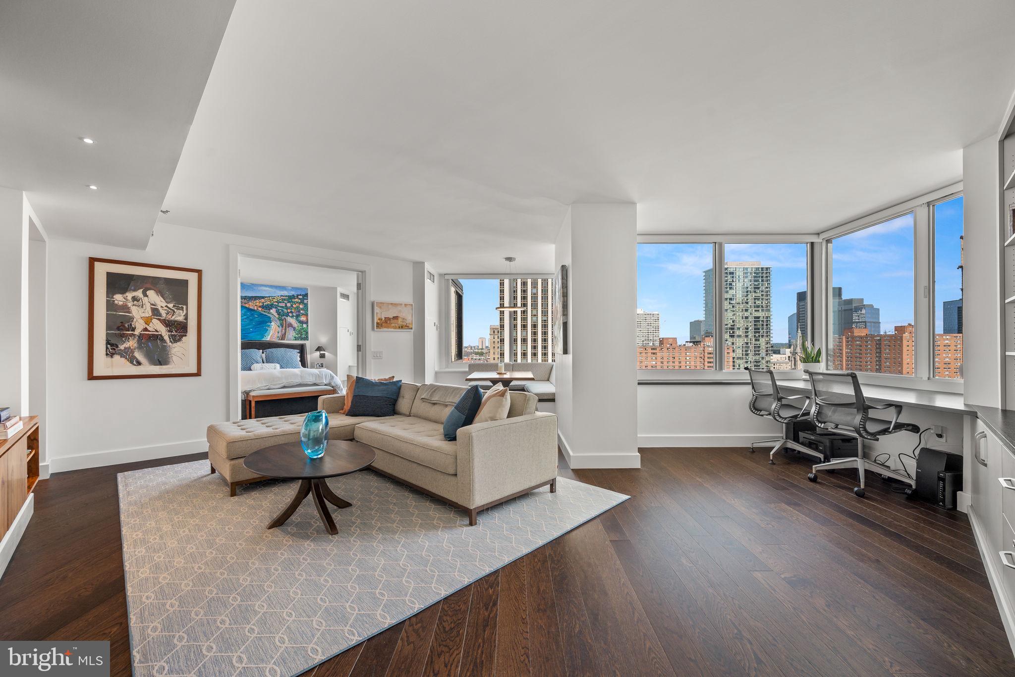 Experience seamless fusion of sophistication and convenience at The Residents of The Rittenhouse, one of Philadelphia's most coveted buildings. Encompassing over 1000 square feet of refined living space, this home boasts timeless elegance. The attention to detail is evident in this stunning redesign and renovation by Mainline Craftsman, including all new expansive windows showcasing stunning cityscapes and sunsets.The kitchen is equipped with a suite of Bosch and GE stainless steel appliances, Pappajohn master crafted cabinetry, Caesarstone counters, glass tile backsplash, a uniquely designed pantry closet, and a wine refrigerator.The great room is the heart of the home featuring a dining area with built-in banquette, a built-in corner desk and bookshelves, custom entertainment console, and a half bath. French doors lead to the bedroom with picturesque city views. The ensuite bathroom features Kohler fixtures, a walk-in shower with floor-to-ceiling mosaic tiled walls, a rain showerhead, a frameless glass door, and a customized linen closet. An oversized walk-in closet completes the suite. Additional details include wide plank oak flooring throughout, an ample hanging coat closet in the foyer, custom window treatments by The Shade Store, and new HVAC systems . This Rittenhouse Residence offers the best of urban living through the world-class services of The Rittenhouse Hotel. Enjoy the many luxury services, including full-service 24-hour concierge (dog-walking and package delivery), room service from 6 AM - 11 PM, housekeeping and laundry, chauffeur-driven Mercedes sedan, a newly renovated health club (additional fee), indoor pool, Paul Labrecque Salon, spa, Lacroix, Library Bar and Scarpetta. On-site valet parking is available for a monthly fee. The Rittenhouse is a pet-friendly building allowing dogs up to 50 pounds. Walk out your front door and enjoy the peaceful fountain, beautiful Rittenhouse Square and being only steps away from many more of the city's finest restaurants and shopping. Don’t miss the opportunity to make this beautifully designed home your own – it’s a unique find that combines style, comfort, and prime location.