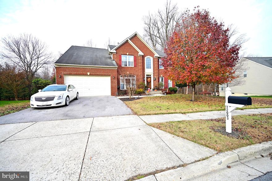 Welcome to this stunning, sun-filled 3-level colonial featuring 5 bedrooms and 3.5 bathrooms, with over 5,000 square feet of living.  As you enter through the center foyer, you are greeted by gleaming hardwood floors that flow throughout the entire main level, staircase, and upper levels.  The main level offers an open layout, including a separate formal living room and dining room, a private office, and a spacious family room with a gas fireplace. A washer and dryer conveniently located in the mudroom off the two-car garage and a powder room on the main level adds to the practicality of the home. The gourmet kitchen is a chef’s dream, featuring granite countertops, stainless steel appliances, a double wall oven, and a gas cooktop built into the center island. You’ll enjoy multiple dining options, including a quick bite at the center island or a meal in the spacious eat-in kitchen.   Off the kitchen is a bright sunroom that can be versatile—perfect for dining, lounging, or simply enjoying the natural light overlooking the serene backyard and your low maintenance deck.  The upper level boasts four generous bedrooms, all with hardwood flooring. The primary suite is truly impressive, offering two walk-in closets, a sitting room, tray ceilings, and a luxurious en-suite bathroom with a soaking tub, separate shower, and a private toilet area.   Three additional bedrooms and a large hall bathroom with a double vanity complete the upper level. The finished basement provides even more living space with a 5th bedroom, a third full bathroom, an expansive recreation area and an additional area with multiple entertainment options with vinyl and wood  flooring.   The lower level offers a walk out exit to almost a half acre of land that backs to a tree lined preserve for privacy.