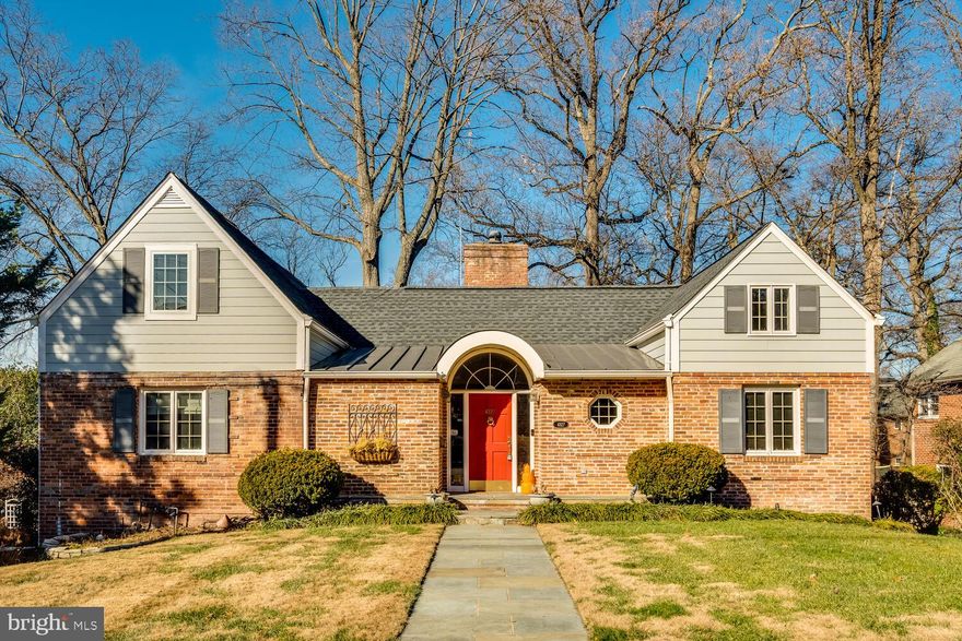 Tucked away on a quiet cul-de-sac in the highly sought-after Shirley Woods neighborhood, this classic stone-and-brick expanded Cape Cod offers approximately 5,000 sq ft of living space, 5 bedrooms, and 4 full baths on a beautiful third of an acre lot.
A welcoming slate foyer opens to light-filled rooms on the main level including the sun-drenched living and dining room featuring soaring ceilings, hardwood floors, a wood-burning double-sided fireplace, and floor-to-ceiling built-ins. The main-level primary suite offers a sitting area and en suite bath. A vaulted sunroom, cozy family room, and updated eat-in kitchen including custom cabinetry and stainless steel appliances as well as an additional bedroom and full bath complete the floor.
Upstairs are two spacious bedrooms with a shared bath. The walk-out lower level, renovated in 2019, includes a large family/recreation room with fireplace, an additional bedroom with full bath, and a flex space that can be used as an office or gym. Outside, enjoy the expansive backyard or dine al fresco on the deck with unmatched privacy and mature trees overlooking the large yard. 
Conveniently located near restaurants, grocery stores, coffee shops as well as the Washington Golf and Country Club, this home's timeless charm, flexible floor plan, and prime Arlington location makes it a once in a lifetime opportunity. Welcome home to 4827 27th Place N!