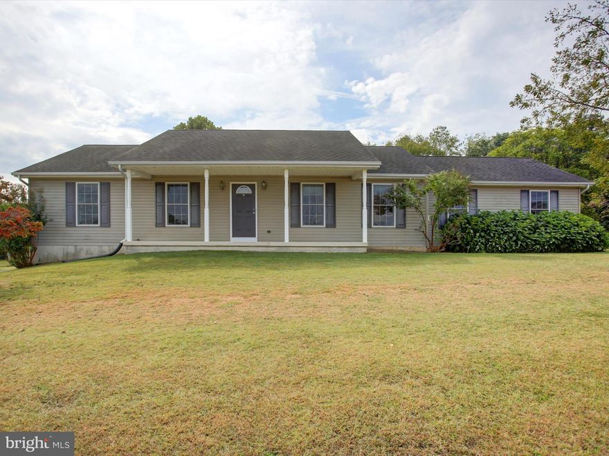 Nice rancher in a rural setting, located approximately 4 miles from I-81. Property is not in a subdivision and has no HOA. Home offers 3 bedrooms, 2 full baths, and an oversized 2-car garage. Features include cathedral ceilings in the living room, kitchen, and dining area, wood floors in the main living spaces, and a spacious kitchen with large island. Living room has a gas fireplace to supplement electric heat. Full unfinished basement provides potential for additional living space. Exterior highlights include a covered front porch, rear patio with retractable awning, shed with electric, and partially fenced backyard with mature landscaping for added privacy. Most features are original to and may need cosmetic updates, but the home appears to be in overall good condition. This is an Estate Sale, seller did not reside in the property, and intends to sell “as is.” Professional pics will be added by 9/17/25 and listing could potentially go active earlier than 9/19/25 (the expected on market date).