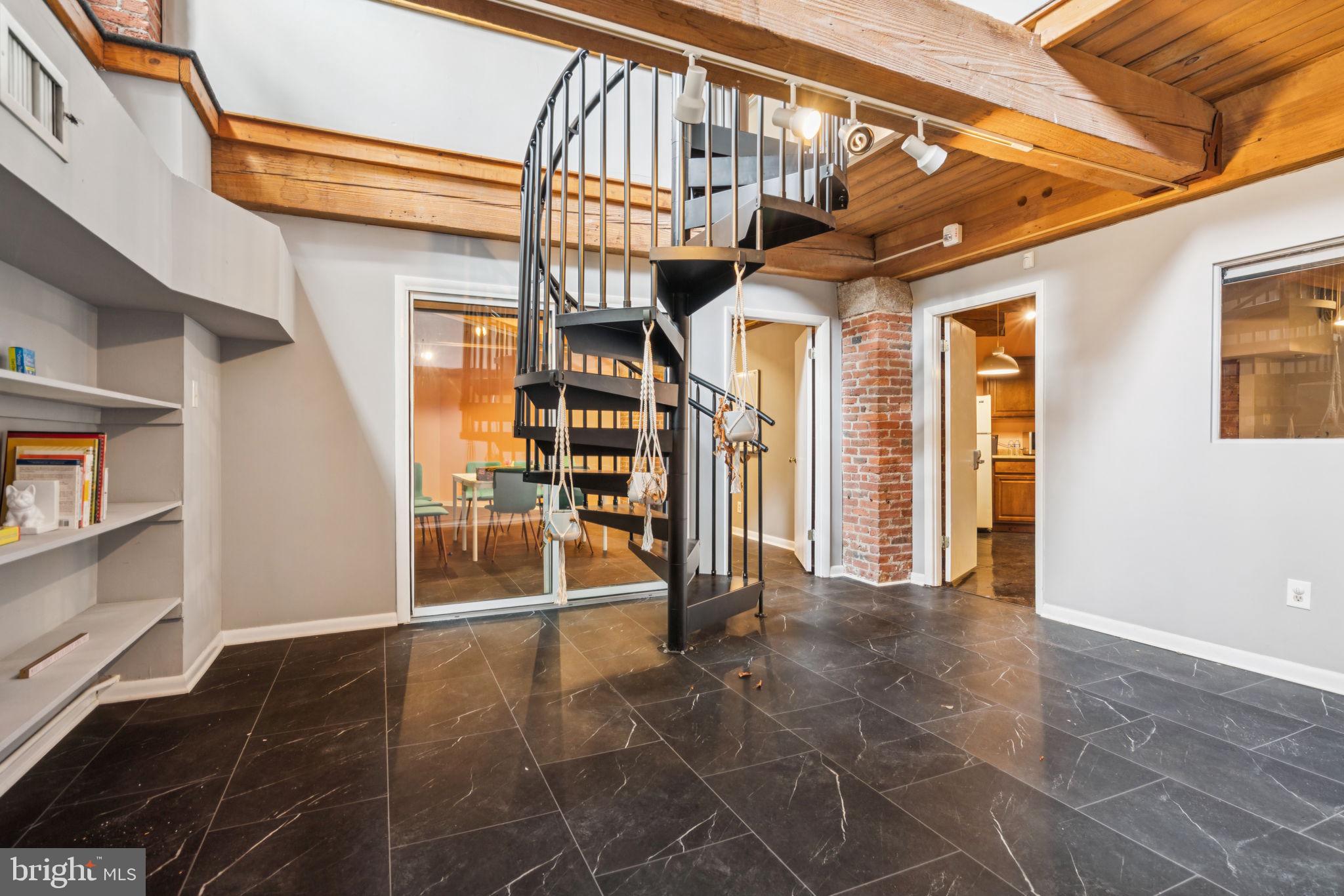 Bright and flexible multi-level space located in the heart of historic Old City. Unit B offers two spacious interior offices, multiple conference areas, a full kitchen and bath, spiral staircase, generous storage, and a striking two-story atrium. Large windows throughout provide abundant natural light. Suitable for a variety of professional uses, with potential for residential conversion. Conveniently located near shops, dining, and public transit.