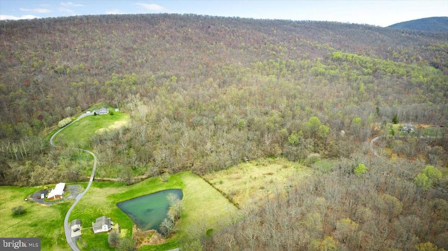 This parcel is it, it’s got everything you’ve been yearning for. A water view, a water feature, mature trees and rolling hills. If you’re looking for a “signature Virginia lot”, this is the one you need to come see. Easy to find off Harper’s Ferry road down pine hill lane. Sweet Run State park is right next door, along with wineries galore, and plenty of hiking nearby too. Build your custom dream home with no restrictions on 15 acres, and enjoy the perks of Western Loudoun living first hand. Within an hour drive to an international airport, DC within an easy drive, and many more major cities. Access already established with Pine Hill lane, should be easy to lay a driveway into your lot,  please reach out if you’d like any more information!