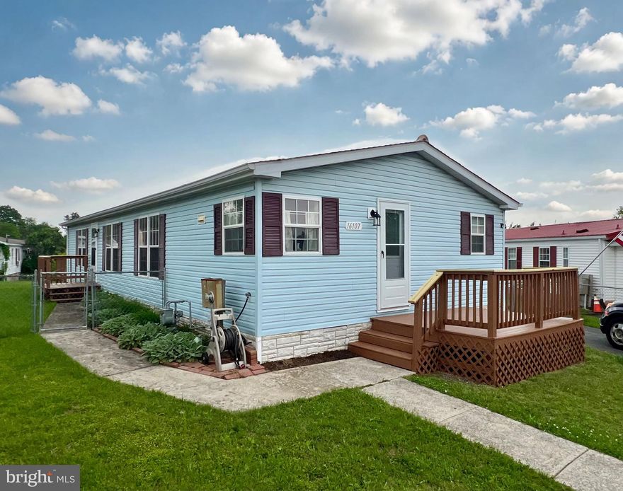 OFFER DEADLINE: 6/9/25 AT 4 PM You have to see this home to believe all it has to offer at such an affordable price...over 1340 square feet of updated living space with 3 bedrooms, 2 full bathrooms and a cozy fireplace as well as a spacious eat-in kitchen with granite countertops and gas-cooking,  and a large deck with mountain views overlooking a fenced yard on a lot you own (no lot rent)!!! This beautifully renovated, low-maintenance single-level ranch-style home with permanent foundation is located on a cul-de-sac. It features a driveway with off-street parking for 4 vehicles along with a fenced area of the driveway with room for your RV or boat. In addition to a backyard shed for storage, there is a one car detached garage/shed with power and room for a workshop, hobby or workout space, and overhead storage. Some of the meticulous renovations and updates completed in the past 2 years include a new refrigerator and garbage disposal, a new hot water heater, new exterior front and side doors, refinished cabinetry, new flooring, newly installed lighting and trim, freshly painted walls, new decking on the rear deck and new top rails and freshly painted and sealed side rails and deckboards on all decks. The A/C was recently serviced and the heating ducts were cleaned last year. With all of the recent updates and a roof that is approximately 5 years old, you can enjoy stress-free living with a low-maintenance home at an affordable price! Convenient to commuter routes 70 and 81, this home is just minutes from restaurants, shopping, parks, and many more amenities as well as the neighborhood park areas. Your HOA fees include common area maintenance as well as trash pick-up, community activities and homeowner website. A 2022 Structural Engineer inspection report stating the home conforms to the HUD guidelines/requirements for Permanent Foundations is available (permanent anchors to concrete pier foundation) and manufacturer's info sheet is posted on electric panel door in 3rd bedroom for reference. Home was not used as a rental.