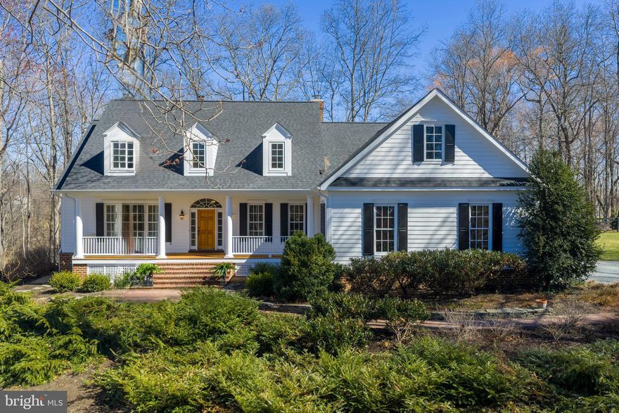 Welcome home to this beautifully crafted custom colonial set on 3.3 scenic acres with peaceful water views in the desirable Ashley Springs community. It is truly one of a kind! Built in 2000 and meticulously maintained, this property offers the perfect blend of timeless architecture, modern comfort, and serene countryside living just minutes from the heart of Purcellville. 
A charming custom front porch with Brazilian hardwood Ipe welcomes you to the home and sets the tone for the quality and craftsmanship found throughout. Inside, the home offers over 4,000+ square feet of finished living space, along with a 2,400 square foot unfinished basement ready to be customized to suit your needs.
The gourmet kitchen is designed for both everyday living and entertaining, featuring granite countertops, a large center island with a gourmet sink, and high-end appliances including a Thermador refrigerator (2024), Viking stove, Bosch dishwasher (2022), and GE microwave (2024). The kitchen flows beautifully into the surrounding living spaces, where two wood-burning fireplaces and gorgeous moldings create warmth and character throughout the home.
The main-level primary suite offers a peaceful retreat with a spacious bedroom, a spa-like ensuite bathroom featuring a soaking tub and enclosed glass shower, and a large walk-in closet. The main level also includes a gorgeous living room with custom built-ins, two private offices ideal for working from home, as well as a mudroom, laundry room and a powder room for everyday convenience.
Upstairs, you’ll find three additional bedrooms. Two bedrooms share a Jack-and-Jill bathroom, while the third bedroom features its own private ensuite bath, providing comfort and flexibility for family or guests. An unfinished space above the garage offers exciting possibilities and could easily be transformed into a game room, studio, or additional living area.
The basement provides an additional 2,400 square feet of unfinished space, offering endless opportunities for customization—whether you envision a recreation room, home gym, theater, or guest suite.
Outside, the 3.3-acre property offers privacy, open space, and beautiful views of nearby water, creating a peaceful setting to enjoy nature, entertain, or simply relax.
Many updates have been made to this home including roof (2019), refinished hardwood floors (2024), HVAC (2025), Heat Pump (2022), Aprilaire humidifier (2024), driveway regraded (2025), septic pump and all floats replaced (2023), well pump and sand filter replaced (2021), and lots more. 
With its thoughtful layout, extensive living space, and stunning natural surroundings, 20322 Sommerset Ct offers a rare opportunity to enjoy custom living in one of Purcellville’s most scenic communities while still being close to local shops, restaurants, wineries, and commuter routes. Make this your home, schedule your showing today!