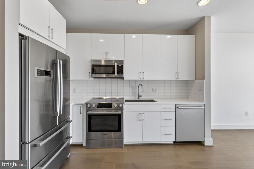 *Assumable 3.25% loan with Substitution of Entitlement* 
Unit 310 at 1500 Pennsylvania Ave SE is a bright, open 1-bedroom + den that lives exactly like a 2-bedroom. It features a flexible layout designed for real comfort, whether used as a guest room or a spacious office.

Enjoy the sleek kitchen with stainless steel appliances; it's a joy to cook in while you glance out the large picture window right down Pennsylvania Ave towards The Capitol. That iconic view of DC is right outside your window.

Maybe you’re not in the mood to cook? It's ok. The Roost Food Hall is steps away. Craving something specific? Chances are, it's there. Not feeling like working from your home office today? You are in luck—Cameo Coffee is perfect to work out of. Afterward, head over to Trusty's for a drink to unwind. Plus, Hill East Burger is right there when you need smoked burgers, stiff cocktails, ice-cold beers, and great tunes.
Even more value is on the way: Streets Market is coming soon right across the street. Grocery runs are about to be effortless.

Need some outdoor activity? The Anacostia River trails and boathouse are just moments away (you can even see them from the rooftop). Heading out of town for work or play? With super convenient highway access to 295, this home is perfect for commuters. Plus, there are 2 Metro stops within 1 mile.

Building amenities include a common roof deck offering panoramic city views, an elevator and bike room.  Experience the ideal blend of urban accessibility and modern comfort.  Ask about VA Loan Assumption with Substitution of Entitlement. Loan at 3.25% interest.
Schedule a viewing today!