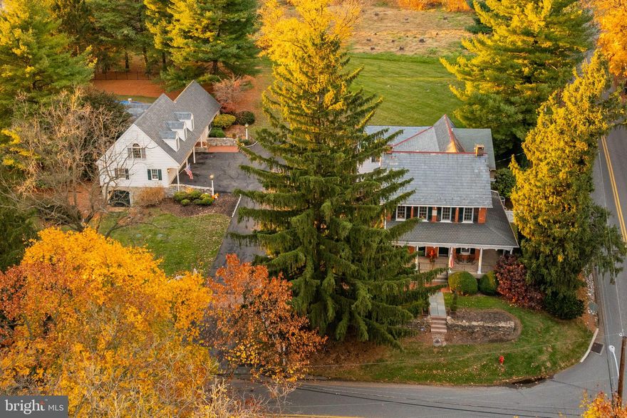 Originally built in 1847, this six-bedroom, 4.5-bath residence, guest house and cabana have been masterfully updated with modern renovations while preserving its timeless elegance. Set on a sprawling two-acre lot, the property features a resort-like ambiance, including a large gunite pool, a private poolside patio, and a dedicated pool house. Enjoy expansive, fenced meadows, a small barn  offering serene vistas and privacy for your own personal retreat. The spacious three-car garage completes the estate, providing ample space for vehicles and space for extra storage, more vehicles or even a shop below.  This rare opportunity combines historic charm with luxurious, modern amenities—creating a truly extraordinary living experience.