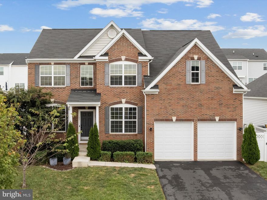 Welcome to this spacious, brick-front home with 5 bedrooms, 3.5 baths, and over 3,500 square feet in the established Shenandoah Springs Community! Built in 2018, this beautiful residence is ideally situated with close proximity to commuter routes and many local amenities. Step into a grand two-story foyer with gleaming hardwood floors that flow into a well-appointed kitchen featuring stainless steel appliances, granite countertops, and a generous pantry for your storage needs. The main level offers a unique floor plan with an open-concept feel that's great for entertaining yet still offers defined spaces. There's a dining room off the kitchen and a sunlit family room, plus a private office and separate living room -- each providing flexibility for work or relaxation. Upstairs, the spacious master suite is a true retreat featuring two walk-in closets, a separate sitting area ideal for unwinding, and a luxurious en-suite bathroom with dual sinks, a large soaking tub, and a tiled shower with bench. Three additional bedrooms and a full bath with double sinks complete the upper level, offering plenty of room for everyone. The finished walk-up basement adds even more living space, including a large recreation room, bonus room, an additional bedroom, and another full bathroom—perfect for guests or multigenerational living. A rough-in for a future wet bar provides great potential for customization, and there's plenty of storage space as well. Enjoy the mornings or evenings outdoors on the large Trex deck overlooking a fully fenced-in yard. Mature, fruit-bearing apple and pear trees add a delicious bonus to this peaceful backyard retreat. A whole-house water purification system enhances the home's livabilty. Don't miss the opportunity to own this well-maintained property in a commuter friendly neighborhood with exciting new developments on the horizon!