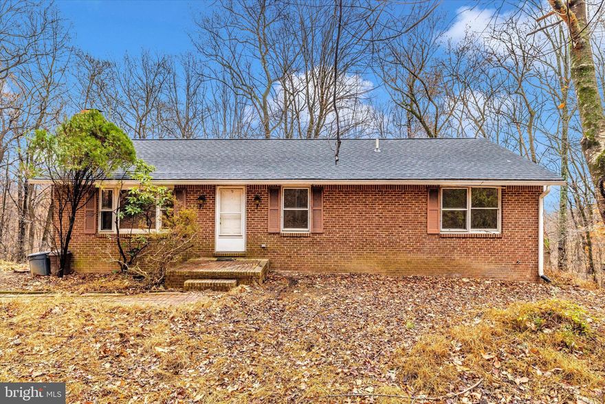 Incredible Investment Opportunity in Knoxville, MD! Set on 4.795 fully wooded acres, this 1987 brick rancher offers the perfect canvas for your next project. Tucked away in a peaceful, private setting surrounded by mature trees, this home is ready for a full rehab and awaits the vision of an experienced contractor or investor. Featuring a classic single-level layout and solid structure, the property provides the foundation for a stunning flip or a customized retreat. The main level offers 1,400 finished square feet, a primary bedroom with a full bath, 2 additional bedrooms and a shared hall full bath while the walk out basement level is an additional 1,400 square feet of unfinished area.  Roof replacement was completed in 2022. The generous acreage delivers seclusion, natural beauty, and endless possibilities. Whether you're looking to transform a hidden gem or add a strong value-add project to your portfolio, this property is a rare opportunity with tremendous potential!