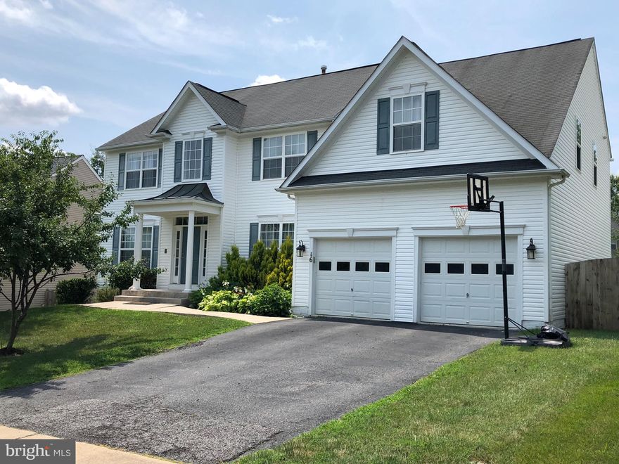 This is the one you have been looking for.  Over 4600 sq ft of great family space.  All three levels fully finished. Brand new stylish bathrooms, gourmet kitchen with island, new fridge, new ovens and dishwasher. Super sized primary bedroom with room for a full living room plus and high end on-suite spa bath.  Three additional good sized bedrooms on upper level with a renovated bathroom.  Main level boasts a 2 story family room, with fireplace, that flows into a fantastic gourmet kitchen with S/S appliances and granite counters.  The main level also has a full sized dining room, living room, office and butlers pantry.  Walk out onto your full side deck overlooking a gigantic, fenced, backyard with vegetable gardens, patio, and sidewalks leading to the front of the home.  Access the backyard from the deck or the walk out level in the lower level of the home.  The garage has openers, storage racks, AND electric car charger!  Wait, the lower level has an entire in-law/teen suite with its own kitchen, living room, den, 2 bedrooms (full sized windows) , 2 full bathrooms and a bar with seating space.  A second laundry room is also in this super space.  Walk straight out to the backyard patio and private sidewalk to the front of the home.  This home is close to schools, shopping, car pool lots, I95, Quantico, and HOV lanes.