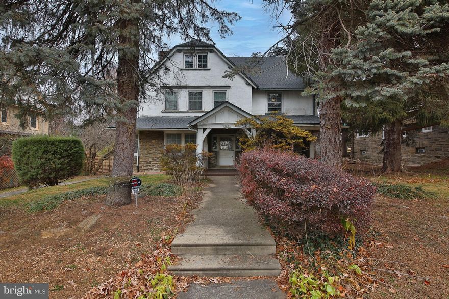 OPPORTUNITY KNOCKS!! Tucked away on a quiet, mature street in historic East Oak Lane, this stately 3-story detached home blends timeless old-world charm with thoughtful updates. Lovingly cared for by the same owner for over 46 years, this 6-bedroom, 2.5-bath residence is filled with character-rich details--- deep windowsills, hardwood floors, pocket doors, high ceilings, abundant wood moldings, and a classic fireplace adorned with Mercer tile that anchors the main living space. Huge formal dining room with recessed lighting offers the perfect setting for hosting upcoming holiday gatherings and memorable celebrations. The expanded kitchen provides a large walk-in pantry and plenty of room for culinary creativity, making entertaining effortless. There is also a sliding door to backyard and a 2nd staircase for easy access upstairs.  There is a powder room on the 1st floor and full bathrooms conveniently located on both the second and third floors, providing flexible living arrangements for guests, family, or home office needs. The 2nd floor bathroom has dual vanity, stand up shower and cast iron clawfoot tub. Recent upgrades include a new roof (2022) and a professionally waterproofed full basement, offering peace of mind for years to come. Additional features include a private rear yard and a large driveway leading to a 1-car detached garage—rare and valuable off-street parking in such an accessible location. The inviting covered front porch is massive and has maintenance free decking which adds to the warmth and charm of this exceptional home. Enjoy the convenience of nearby shopping, local restaurants, SEPTA Regional Rail and subway lines, major roadways, proximity to Montgomery County and Center City. Full of history, character, and potential, this gracious home is ready for its next owner to add their personal touches and make it their own. Schedule your private tour today!