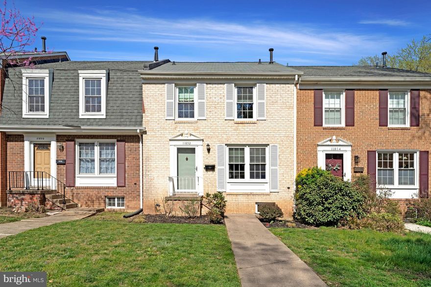 OPEN HOUSE Saturday 4/11 from 2:00 - 4:00 ** Beautifully updated brick townhouse in the Deepwood neighborhood in Reston ** Rare 5 level Falcon model ** Welcoming foyer w/ big coat closet & updated half bath w/ bronze basin and tiled wall treatment ** Updated lighting fixtures and custom window treatments throughout the home ** Gorgeous, ultra-modern kitchen w/ quartz countertops and expanded cabinetry - including pantry space ** GE Cafe Wi-Fi-enabled appliances including  6-burner gas range w/ double oven, French door refrigerator, and convection microwave ** Deep kitchen sink w/ drain rack ** Oak hardwood flooring in dining room, stairwell and upper hallway ** Large dining room with custom wrought iron railing overlooks living room ** Living room features vaulted ceiling and sliding glass door to the back deck ** Down one level to the cozy family room, with electric fireplace & built-in bookshelves ** Large utility room also on this level, with front-loading washer & dryer, deep sink ** Lowest level provides fantastic storage space ** Back up on the main level, take the updated stairs up to the bedroom level ** Primary suite features ceiling fan w/ light & remote, walk-in closet, renovated private bathroom ** Linen closet in hallway ** Two additional bedrooms share the  renovated hall bathroom ** One assigned parking space behind the home and plenty of visitor and street parking ** Deck/fence 2019, Water heater 2015, Roof 2014, Windows & sliding glass door 2009 ** The Deepwood community is an independent HOA, not subject to the annual Reston Association fee.  Deepwood amenities include a swimming pool, playgrounds, and trails ** Less than a mile to the shops and restaurants at Hunter Woods Plaza, and the Reston Community Center ** Bus stops on the block, two metro stations within 3 miles, easy access to Dulles Airport and the Dulles Toll Road ** Don't miss this one!