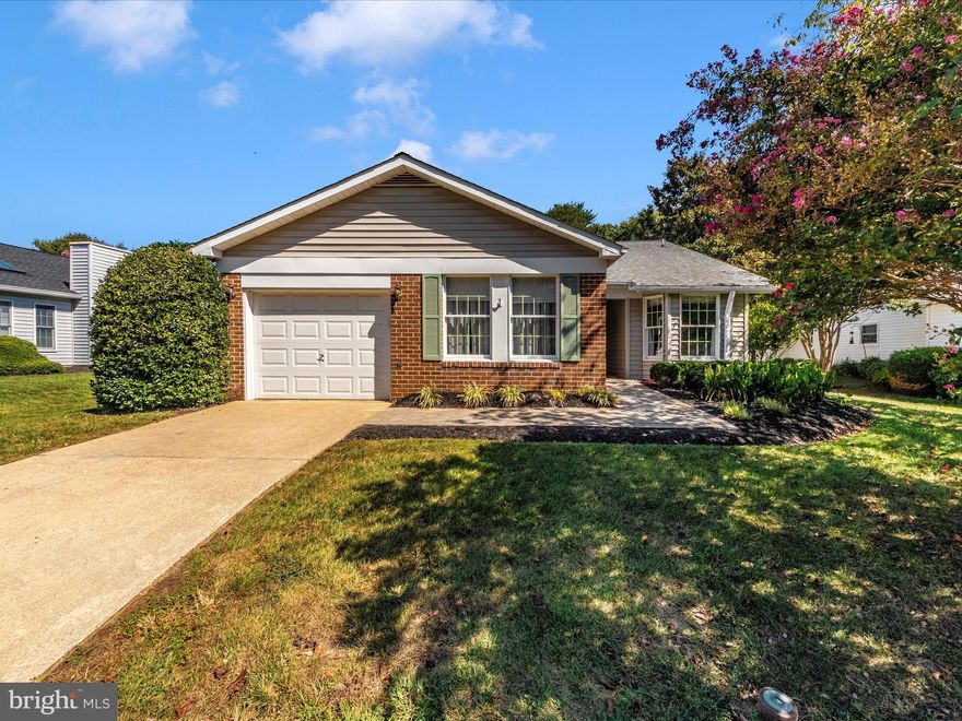 You won't want to miss out on this Rambler home at townhouse pricing in Heritage Harbour! This 2-bedroom, 2-bathroom home has newer laminate flooring in several rooms! It offers a thoughtful layout designed for convenient main level living. Entry is made through the foyer when you enter the home. This makes way to the dining, living room and sitting room/den area as well.  Bedroom 1 has a large walk-in closet and access to a full hall bath.  The fully equipped kitchen includes a table space area.  The primary bedroom has an on-suite bathroom with a stall shower.   A rear sitting room boasts views of the backyard and paver patio area.  The Heritage Harbour 55+ Community offers numerous amenities including community center, a fitness center, private nine-hole golf course, indoor & outdoor pools, library, tennis courts, bocce ball, kayaking, paths, and more! Located just minutes from RT 50 and I-97 with easy access to Downtown Annapolis.