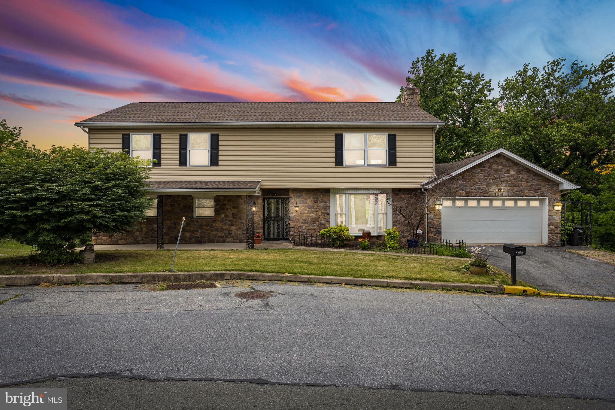 Come visit this tremendous 2 family home in the Governor Mifflin School District that has been recently updated w/ NEW carpet & paint 1/2025! ! This whopping 5,100+ sq ft home includes 7 bedrooms, 4 full bathrooms, 2 full kitchens, In-Law Quarters and a garage on the main level and an oversized 2 car garage on the lower level. As you enter the main floor to the right is a spacious living room w/ fireplace, eat-in kitchen w/ island, & dining area. To the left of the living room you'll find 3 of the private bedrooms and 1 full bath. As you stroll to the right wing of the home there are 2 more large bedrooms, including the master with a huge walk-in closet, full bath with a jacuzzi tub, & main floor laundry area. The upper level includes a large family room with 2 additional private bedrooms ( again nicely sized!), a walk-in closet/storage area and a 3rd full bathroom. The huge game/living area is such a great room with enough room for everyone to relax and entertain w/ NEW carpet as of 1/2025. The finished walk-out lower level has a nicely sized in-law suite w/ a variety of options for use. This space is "completely independent" and boasts a full kitchen, sunroom, laundry room, second fireplace and still a few storage rooms! Additional features include the oversized 2-car garage with workspace, a walk-up attic for storage, patio area for outdoor enjoyment, and a new HVAC (2022) system. All this is conveniently located just minutes away from Rt 222, major routes and the Turnpike but still situated in a mature neighborhood!