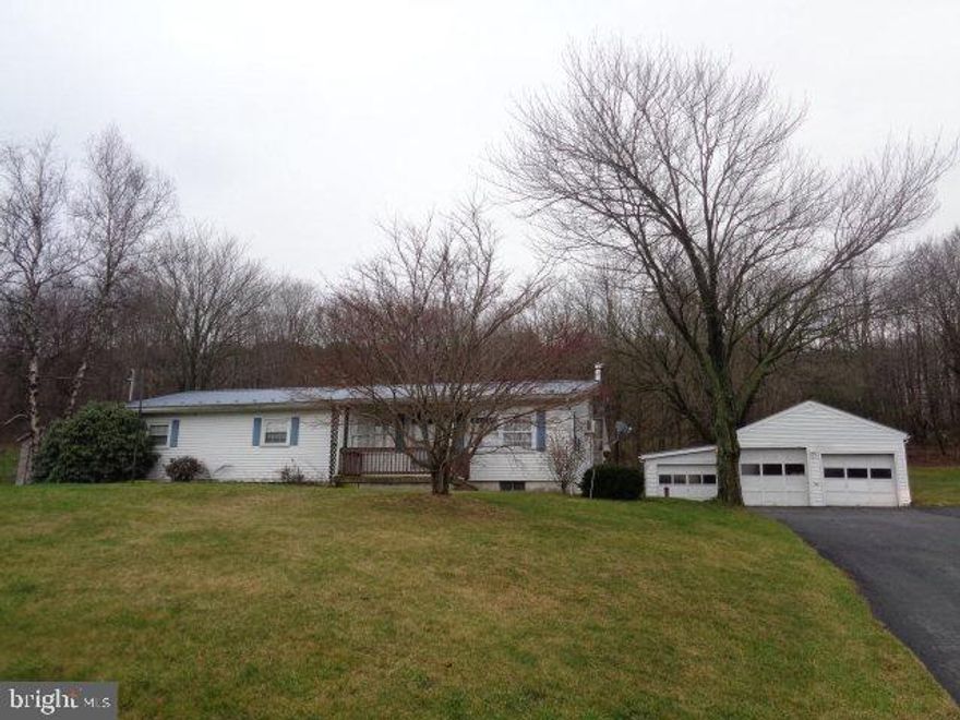 Beautiful mountain views from this well kept double wide on a foundation. Large 24 x 24 detached garage and 12 x 17 detached garage. Newer windows, bath, vinyl siding. Enclosed sun porch, 150 x 200 lot. Well and septic. Septic was pumped and approved by SEO.